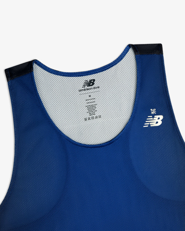 ALD / New Balance Running Gradient Singlet in blue with black shoulder trim and white logo, shown front flat.