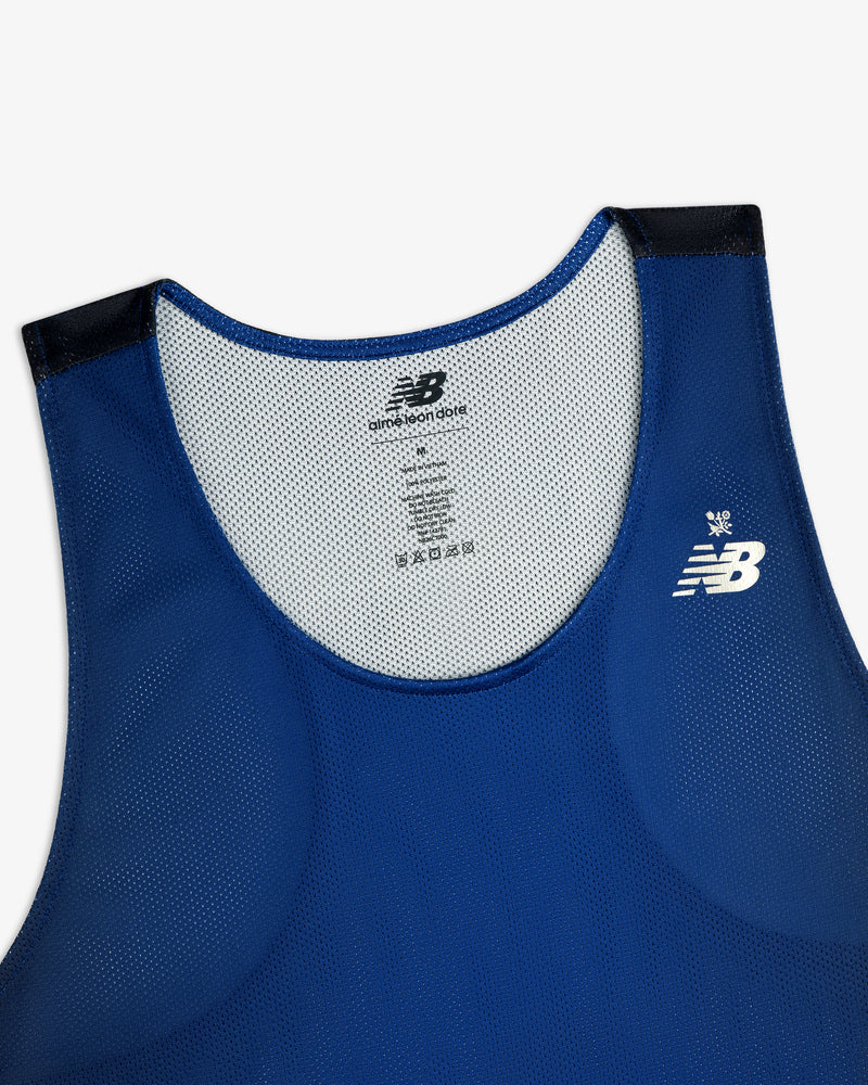 ALD / New Balance Running Gradient Singlet in blue with black shoulder trim and white logo, shown front flat.