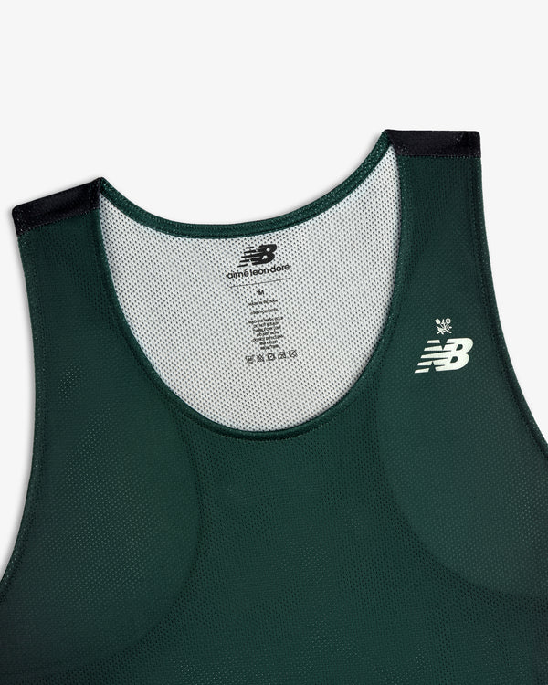 ALD / New Balance Running Gradient Singlet in dark green with white chest logo, shown on white background.