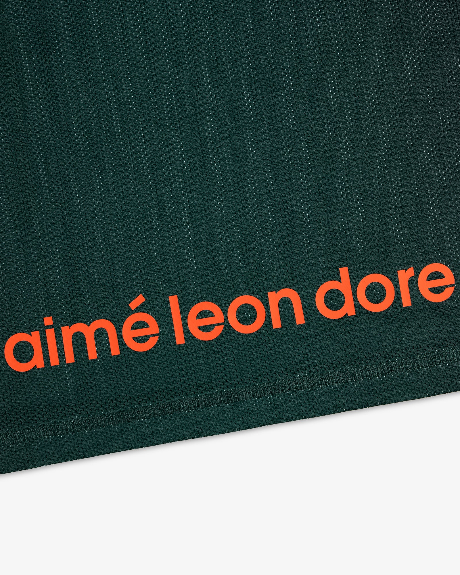 Dark green ALD / New Balance Running Gradient Singlet with bold orange aimé leon dore text near the bottom edge.