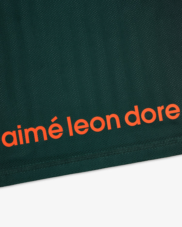 Dark green ALD / New Balance Running Gradient Singlet with bold orange aimé leon dore text near the bottom edge.