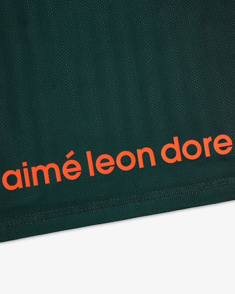 Dark green ALD / New Balance Running Gradient Singlet with bold orange aimé leon dore text near the bottom edge.