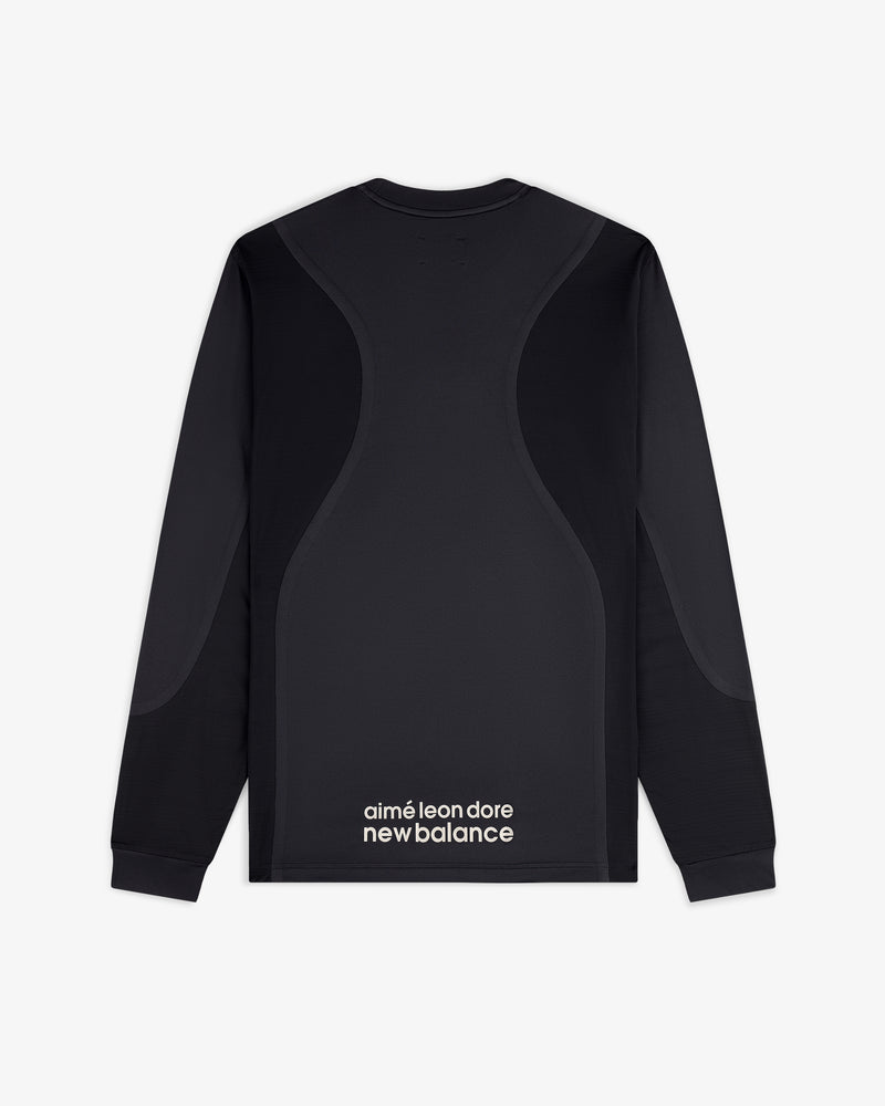 ALD / New Balance Performance Long-Sleeve Tee features curved panel designs and logo text on the lower back.