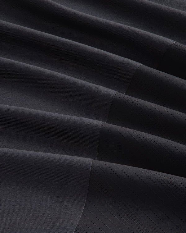Close-up of ALD / New Balance Performance Long-Sleeve Tee in black with diagonal ribbing and stitched geometric lines.