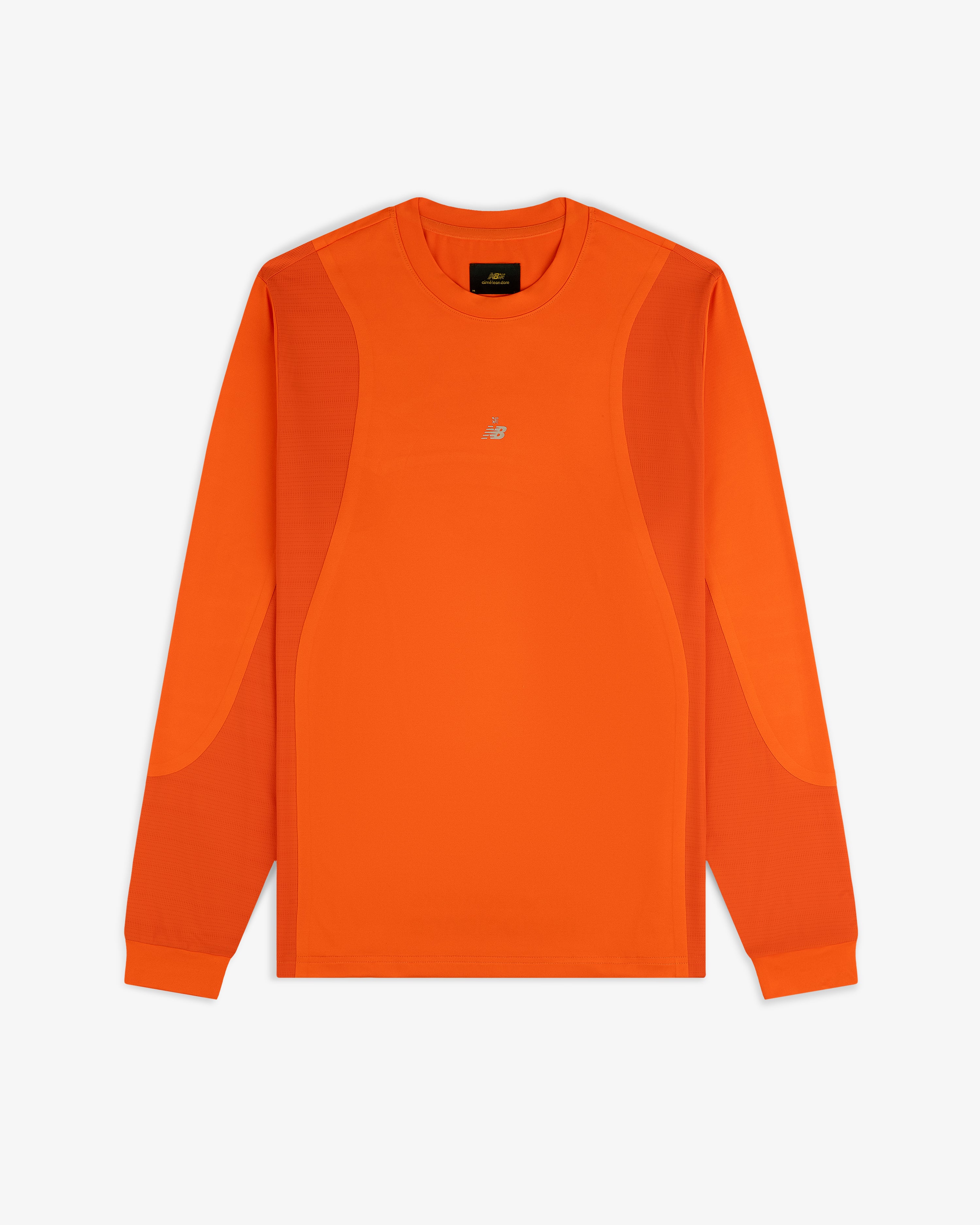 ALD / New Balance orange performance long-sleeve tee with panel details and small white chest logo, laid flat on white.