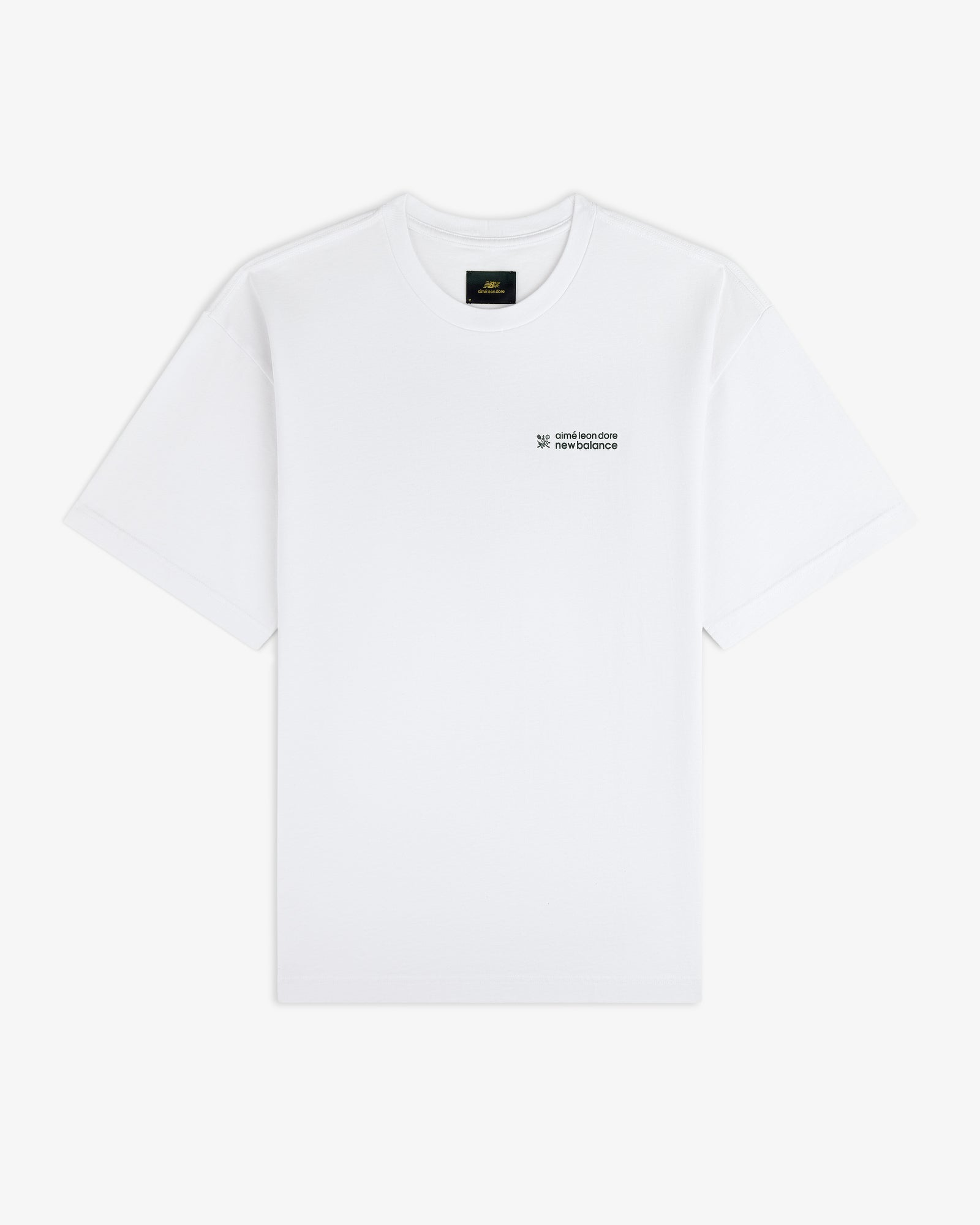 ALD / New Balance Running Bib Tee in white with small black chest text, shown on a plain white background.