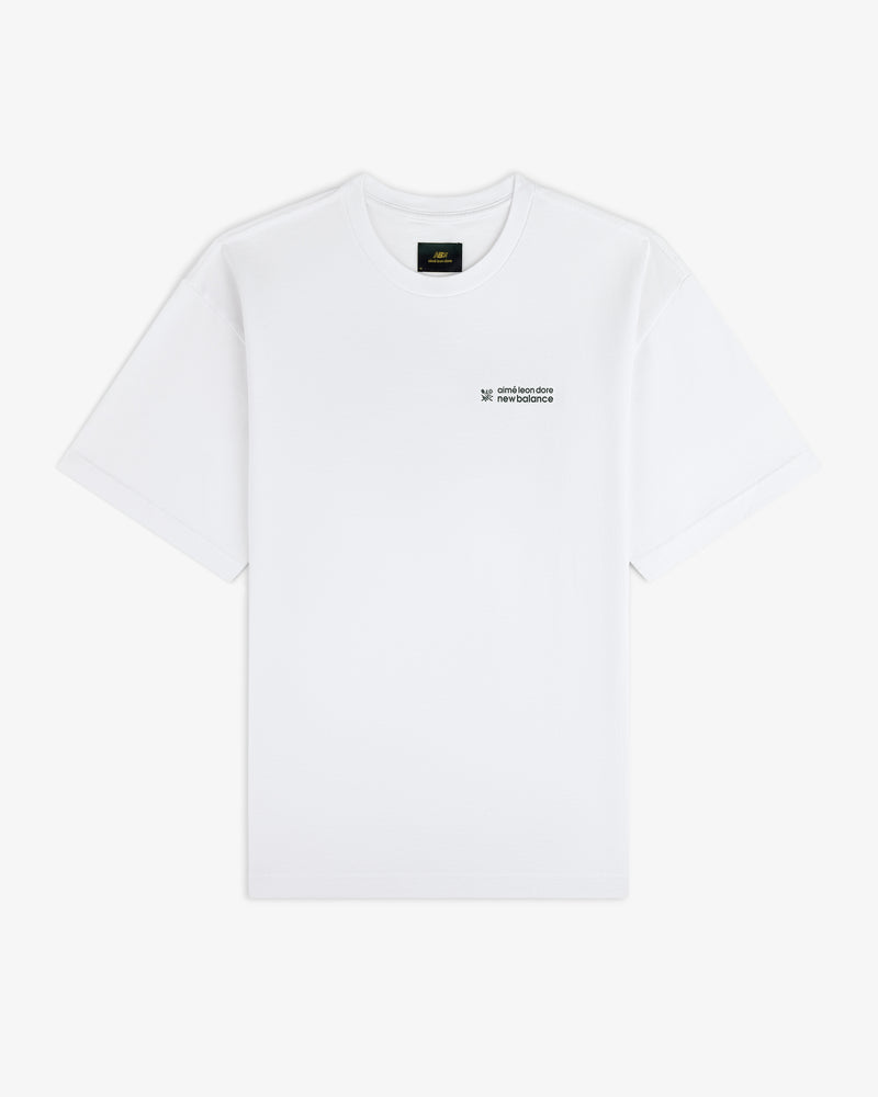 ALD / New Balance Running Bib Tee in white with small black chest text, shown on a plain white background.