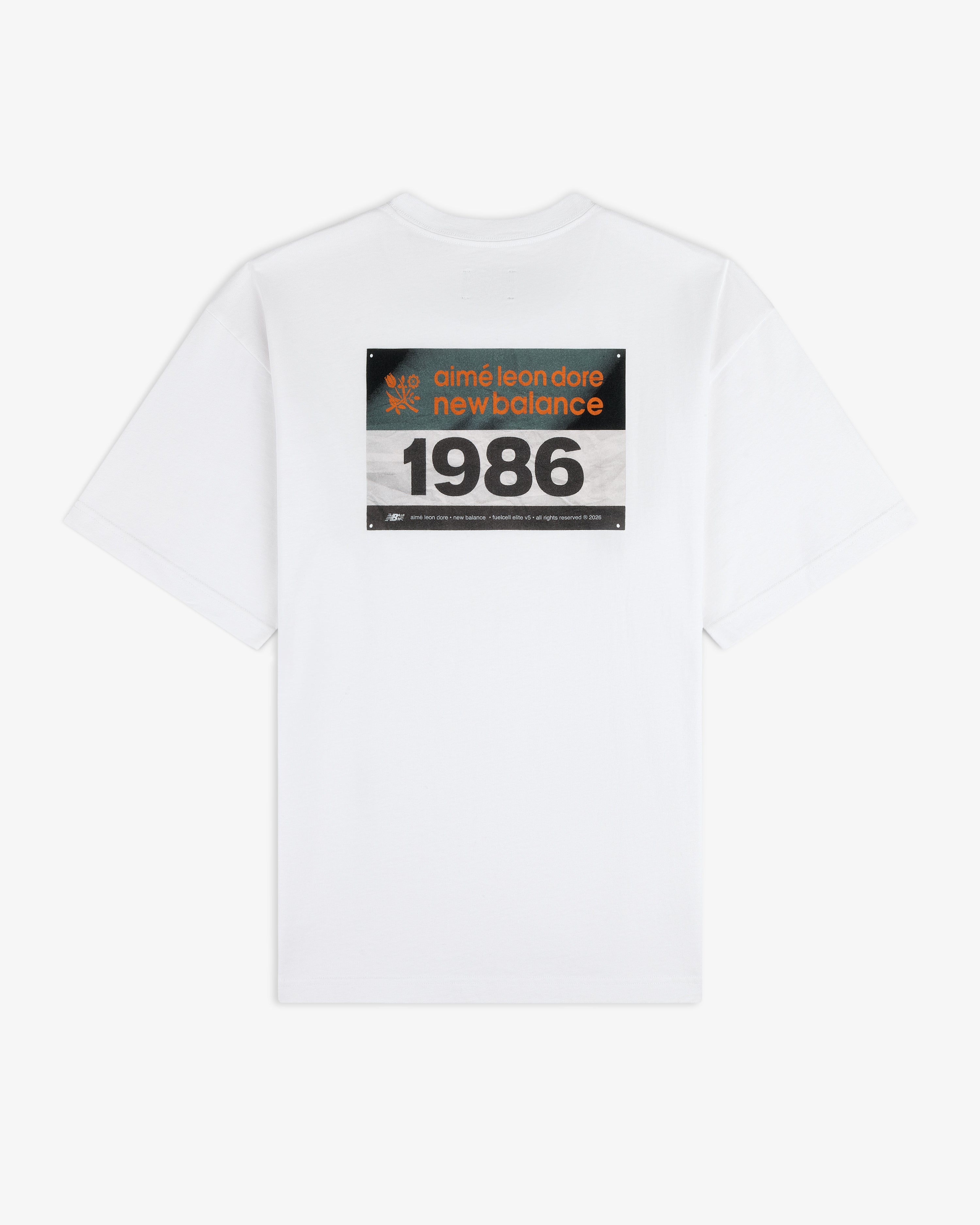 White ALD / New Balance Running Bib Tee with a large 1986 graphic on the back.