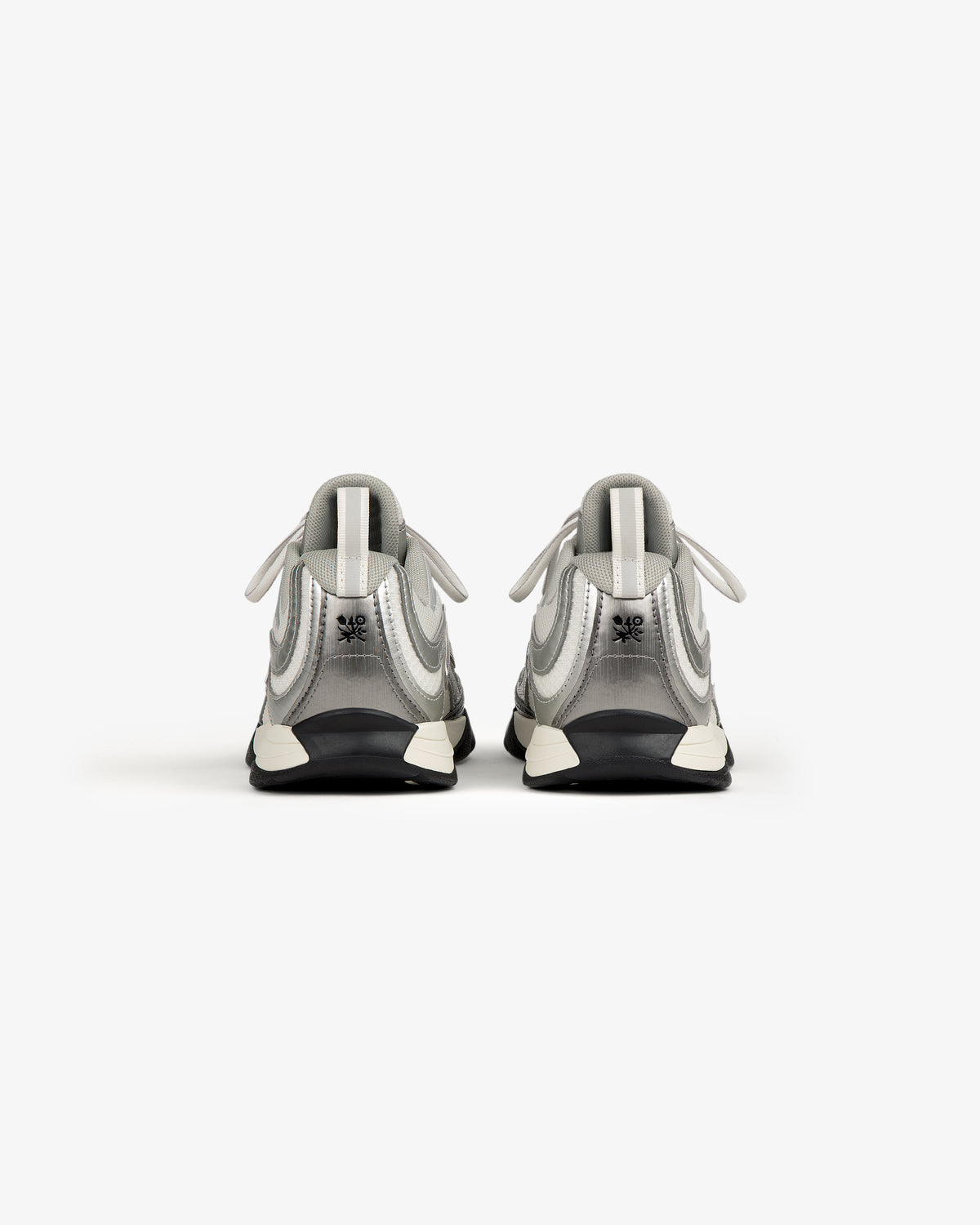 The ALD / New Balance RC56 sneakers in white and gray, viewed from the back on a plain white background.