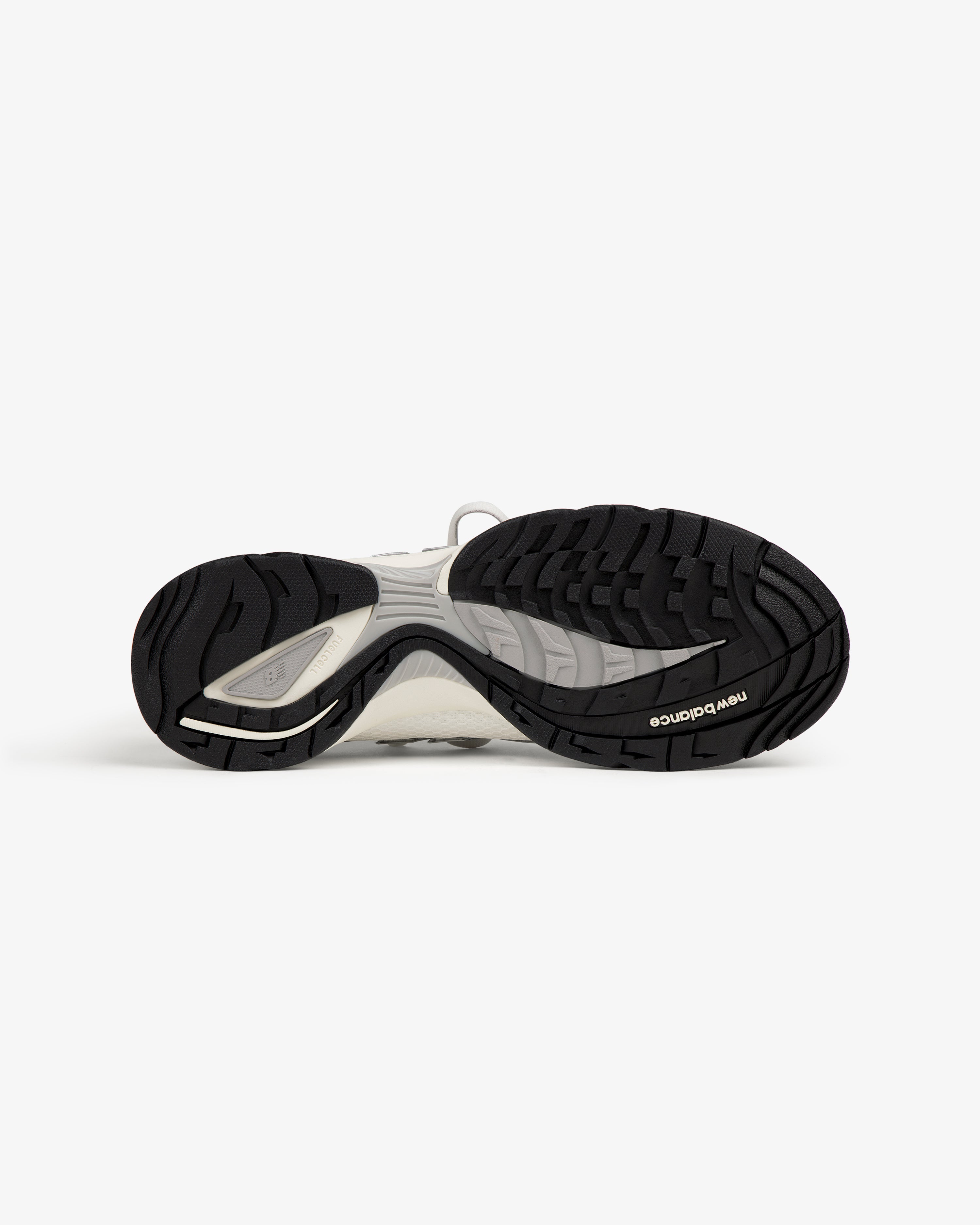 Bottom view of ALD / New Balance RC56, featuring a black textured rubber sole with the New Balance logo.