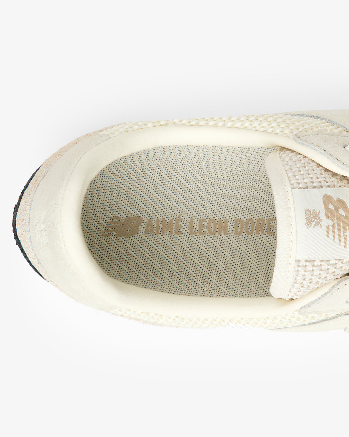 Top view of the ALD / New Balance Gator sneaker in cream with Aime Leon Dore and NB logos on the insole.