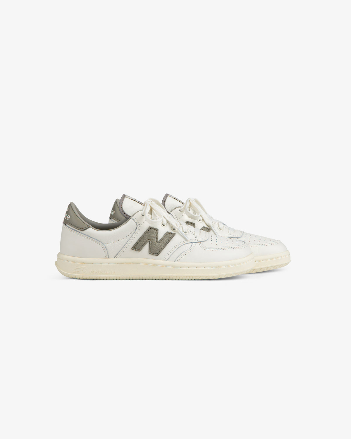 Off-white ALD / New Balance T500 Tennis Oxfords with a grey logo patch and heel tab.