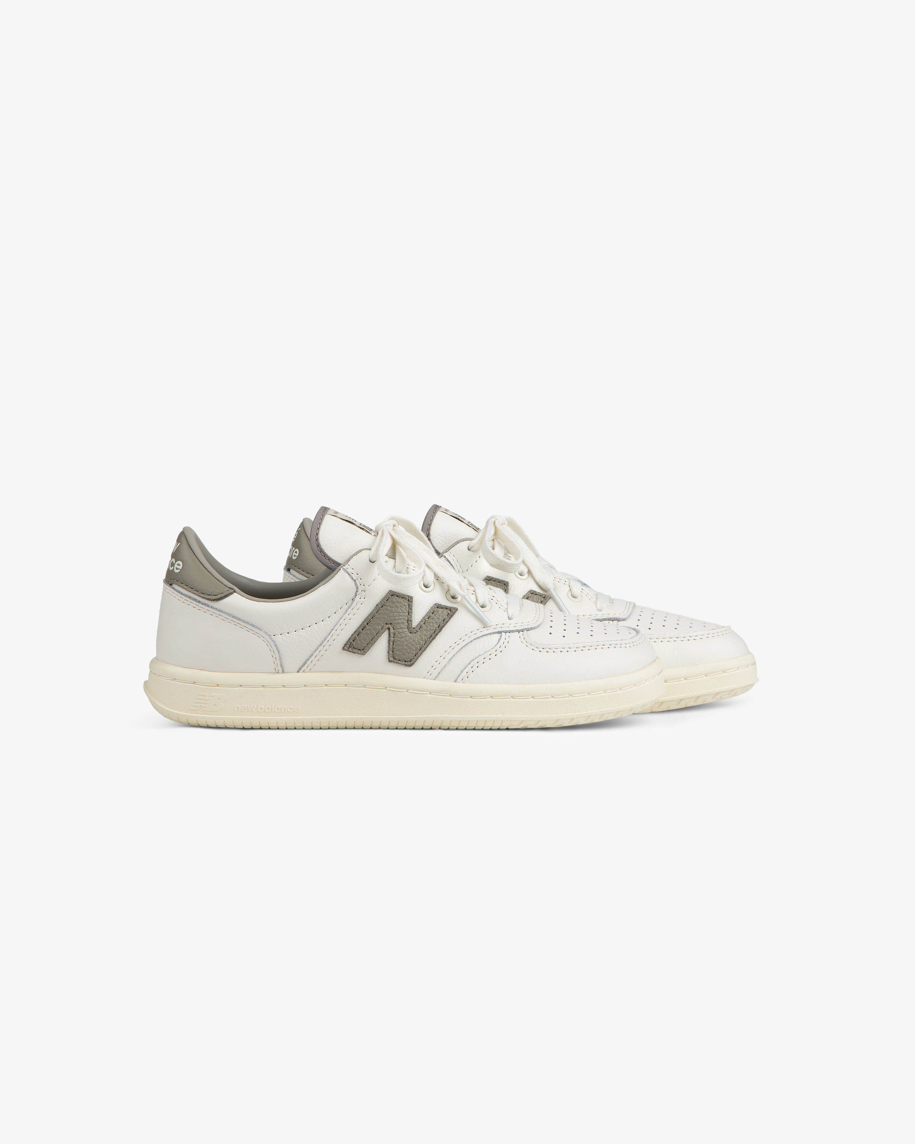 Off-white ALD / New Balance T500 Tennis Oxfords with a grey logo patch and heel tab.