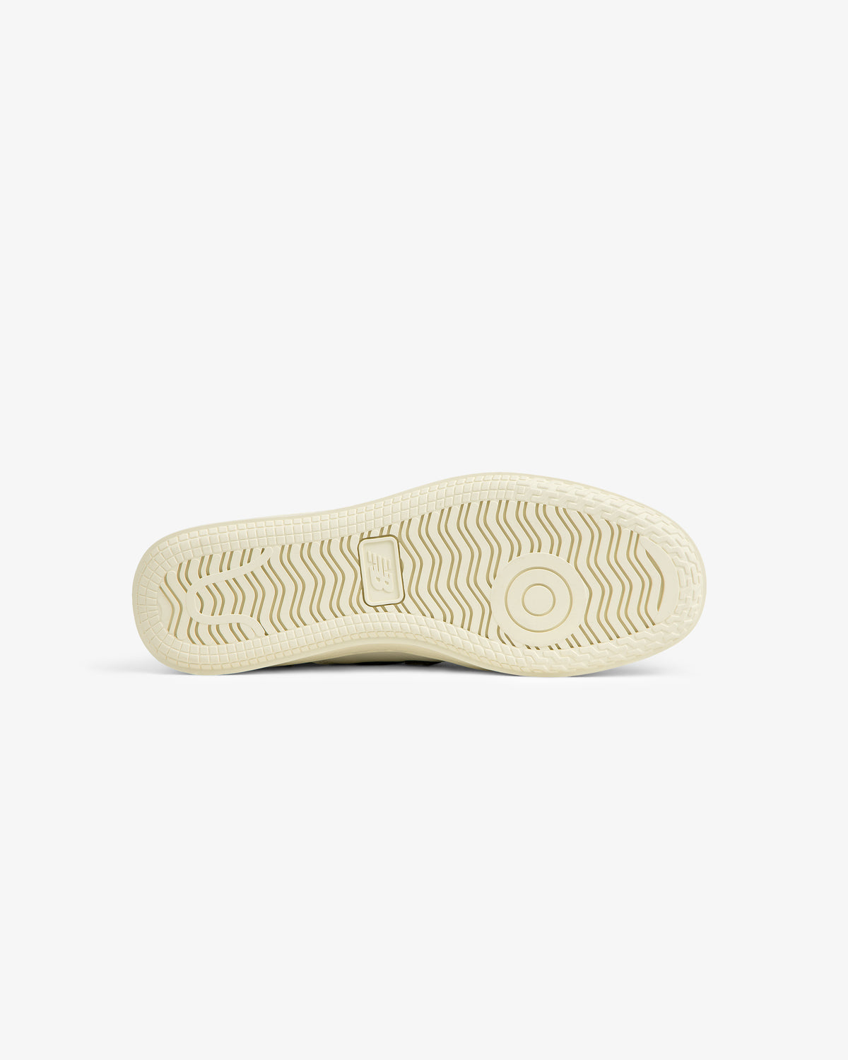 Off-white sole of the ALD / New Balance T500 Tennis Oxfords with a textured tread pattern.