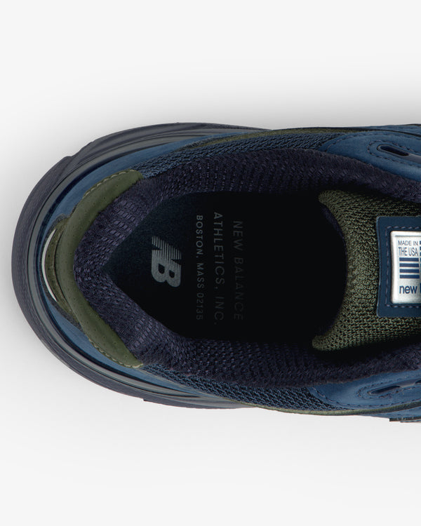 Top view of blue/green New Balance Made in USA 990v4 sneaker showing branded insole.