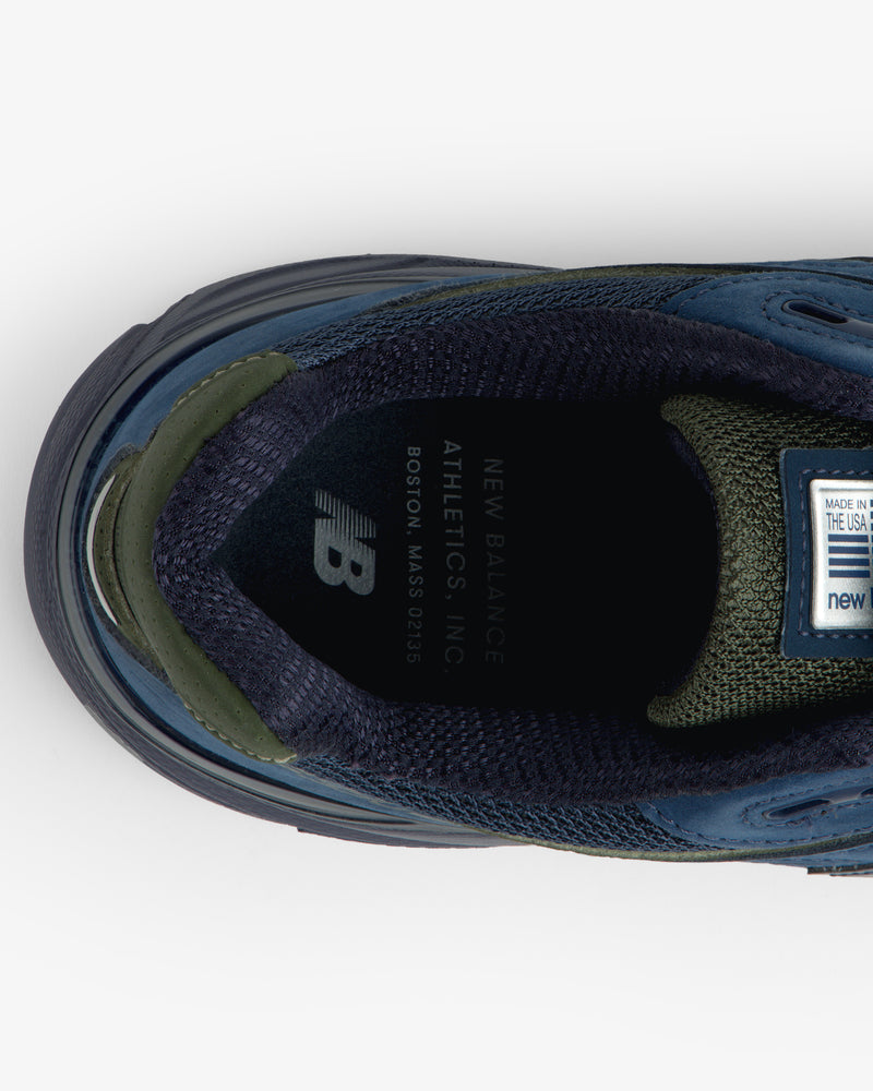 Top view of blue/green New Balance Made in USA 990v4 sneaker showing branded insole.