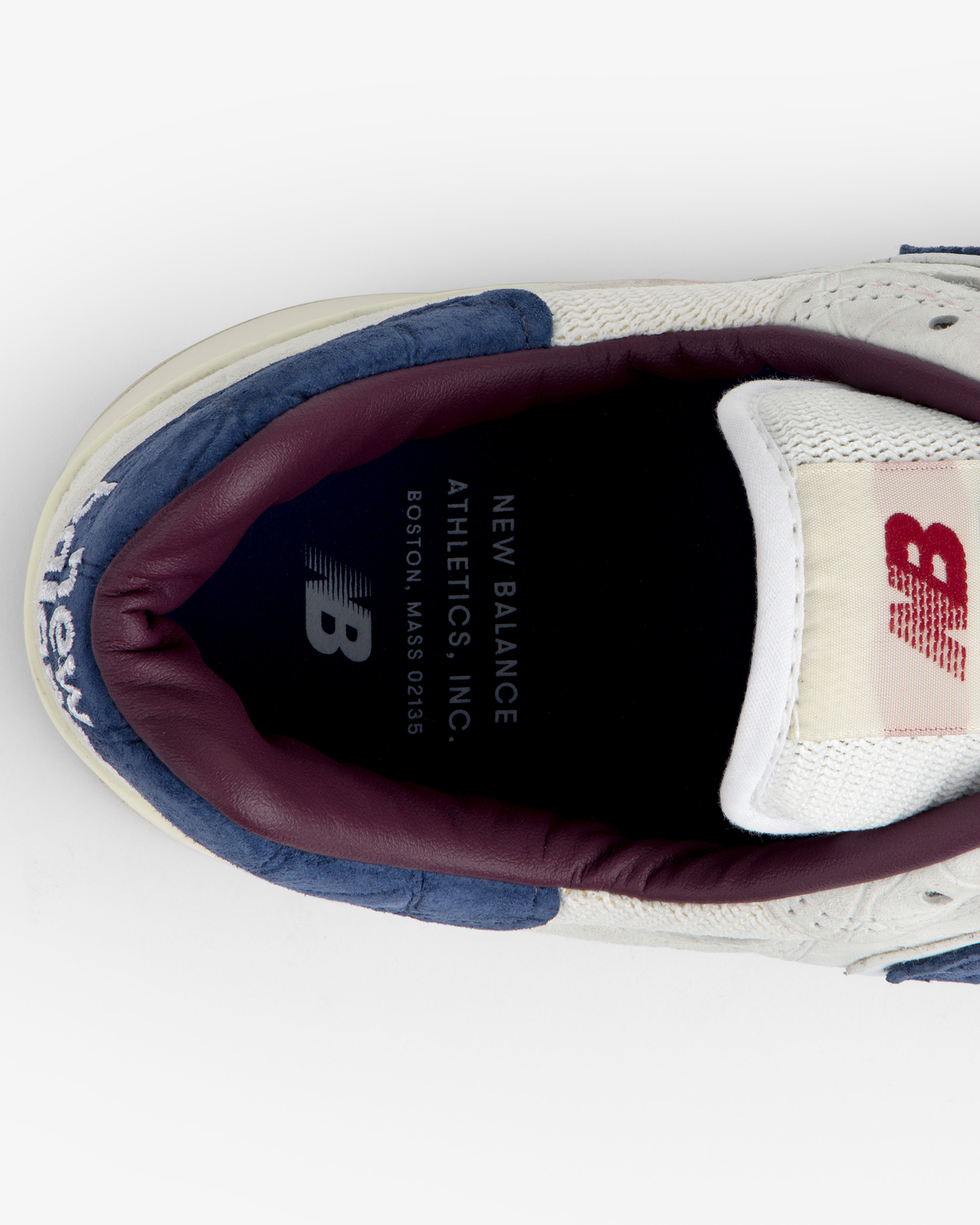 Top view of the New Balance Made in USA 1300 showing insole branding plus part of the collar and tongue.