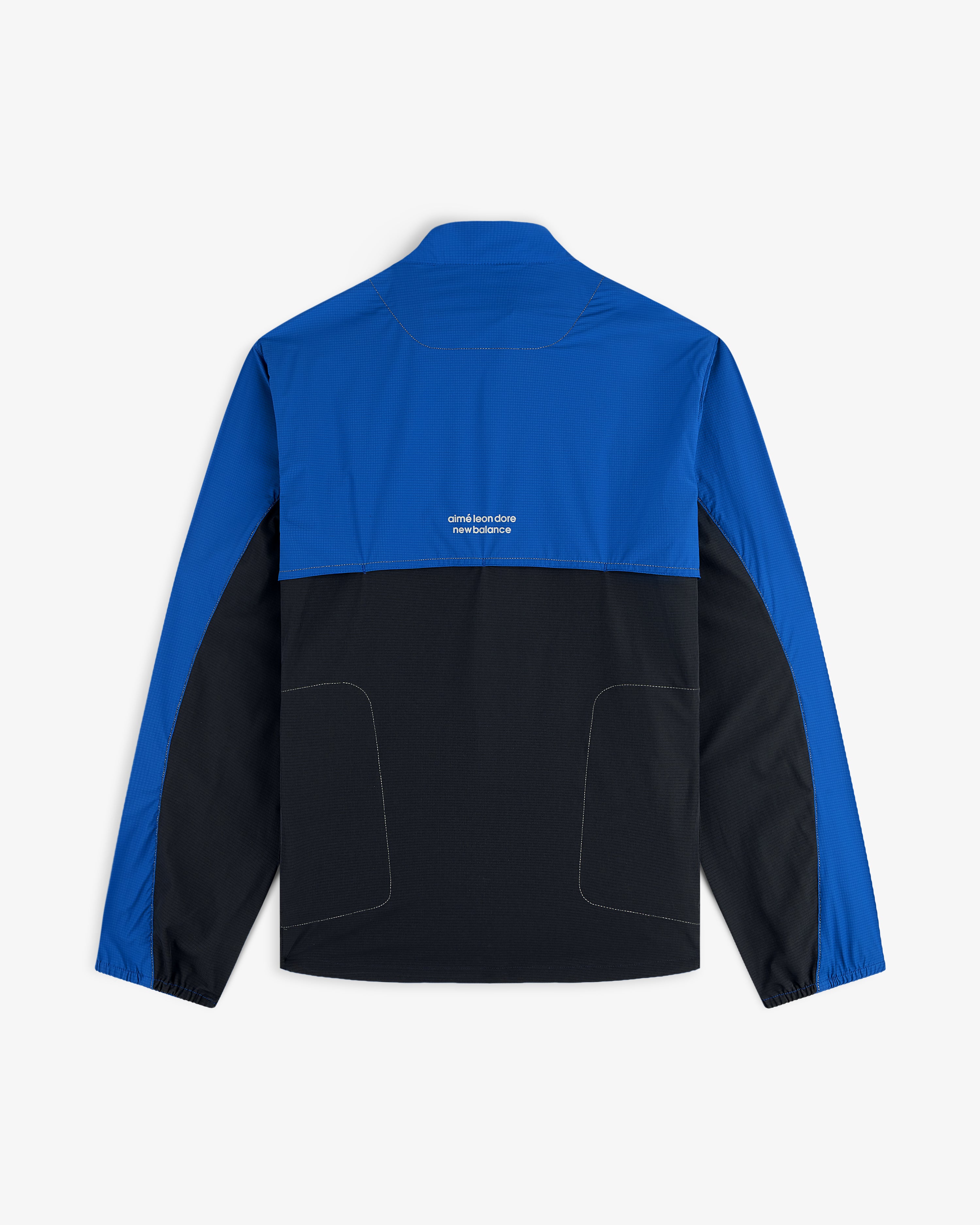 The ALD / New Balance Performance Nylon Jacket features blue upper/sleeves, black lower half, and white text on back.