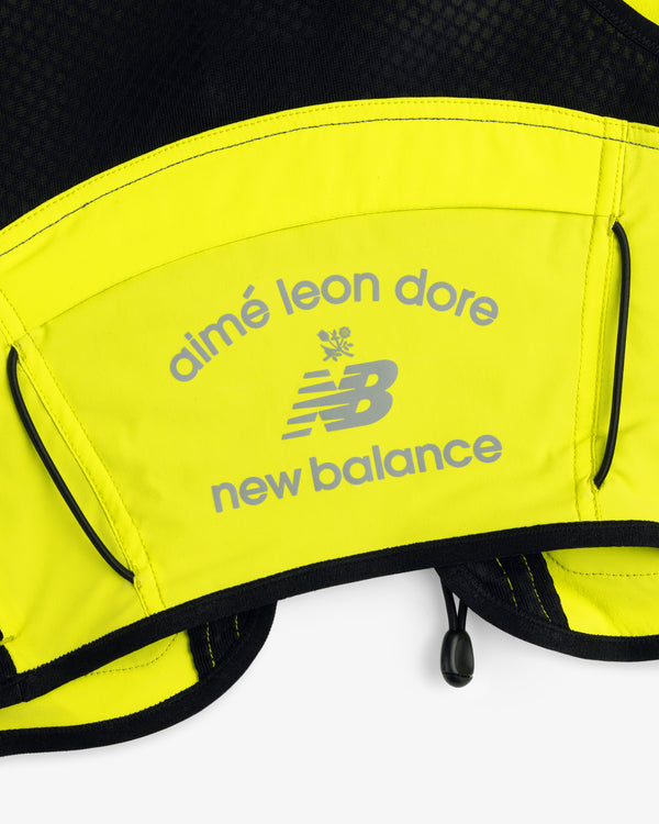 Close-up of the ALD / New Balance Hydrovest featuring yellow and black colors with gray logos.
