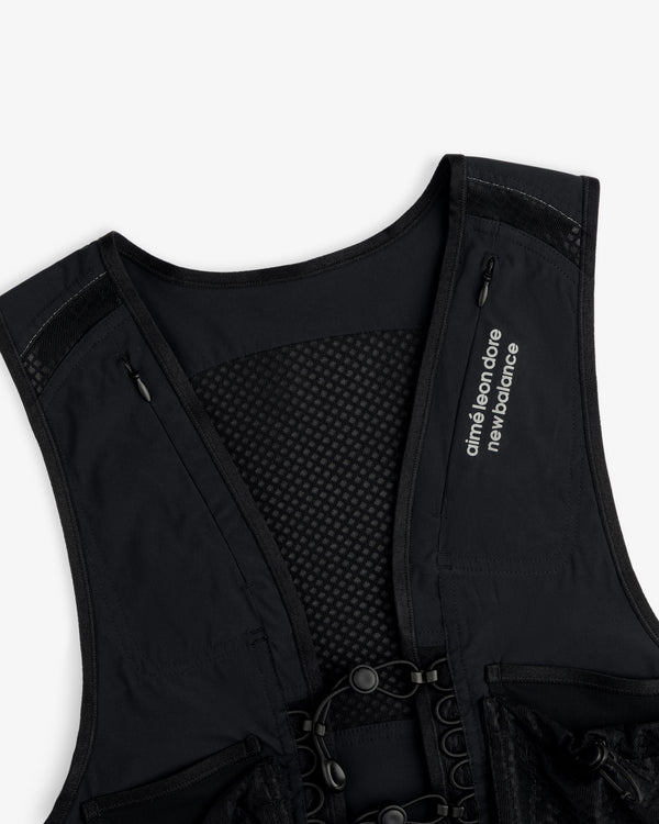 Close-up of a black ALD / New Balance Hydrovest with branding on the left chest.