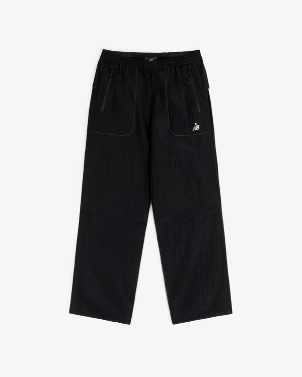 ALD / New Balance Lightweight Nylon Warmup Pant with wide legs, front patch pockets, elastic waist, and white logo.