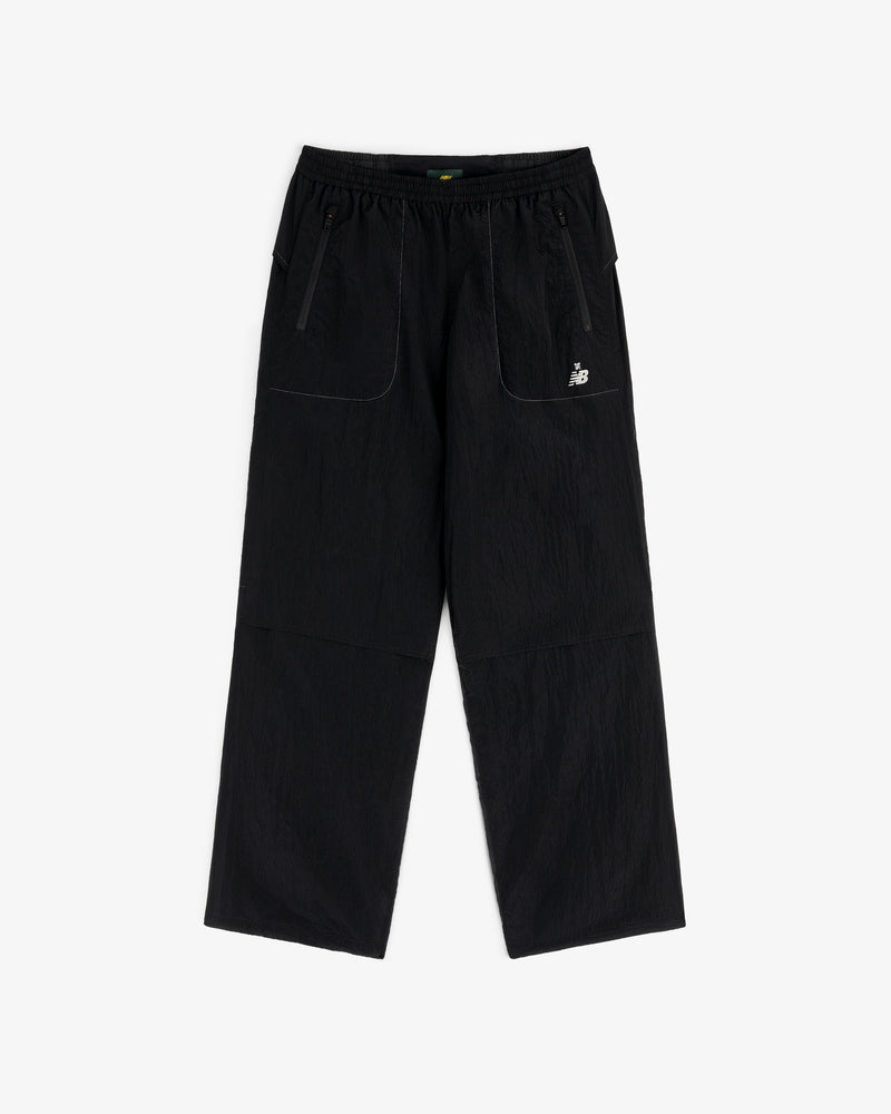 ALD / New Balance Lightweight Nylon Warmup Pant with wide legs, front patch pockets, elastic waist, and white logo.