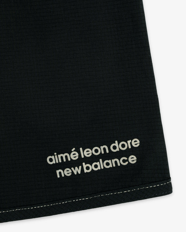 Black ALD / New Balance Performance Lightweight Running Short with white logo near a stitched edge.