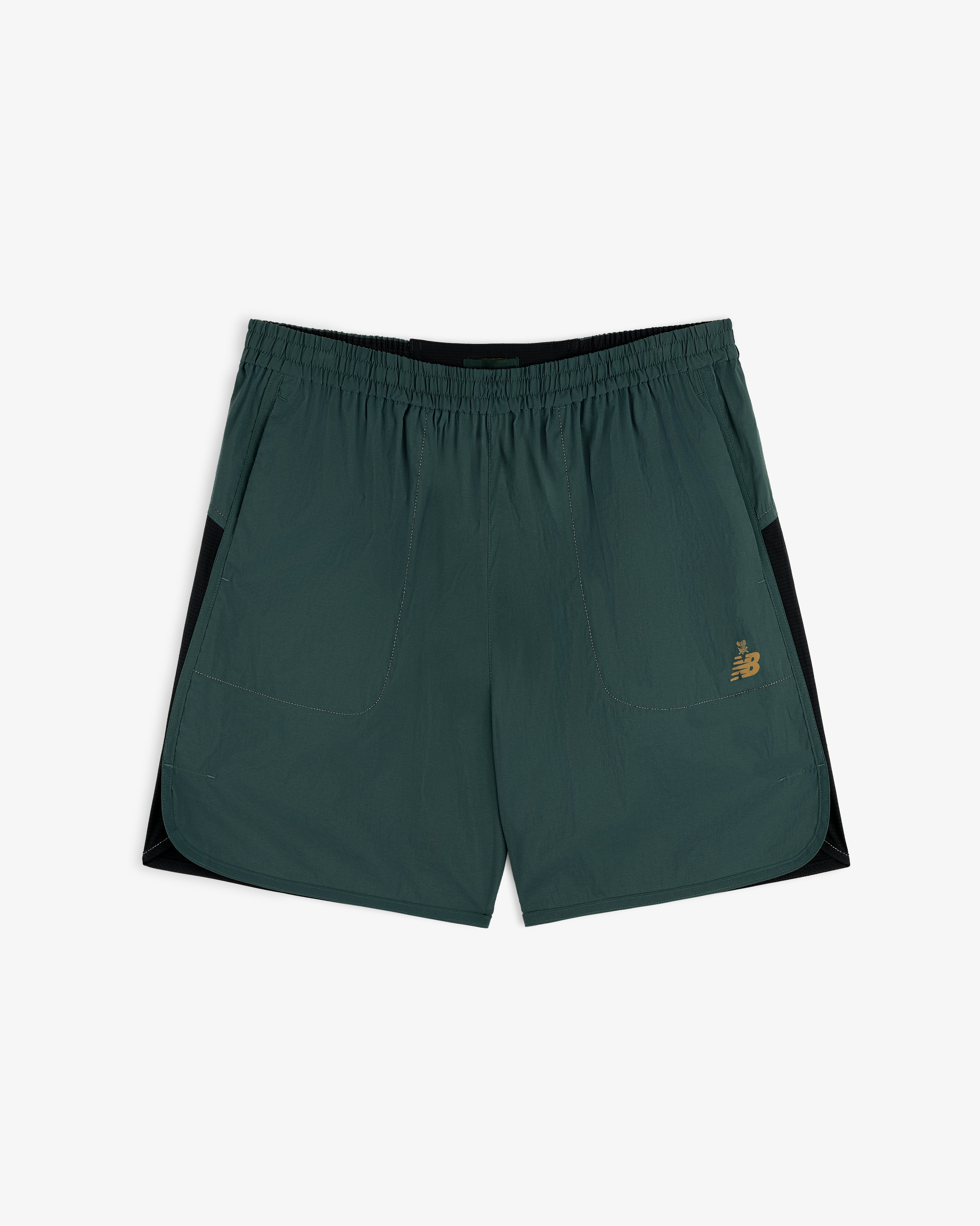 ALD / New Balance Performance Lightweight Running Short in dark green with black panels and gold logo on left leg.