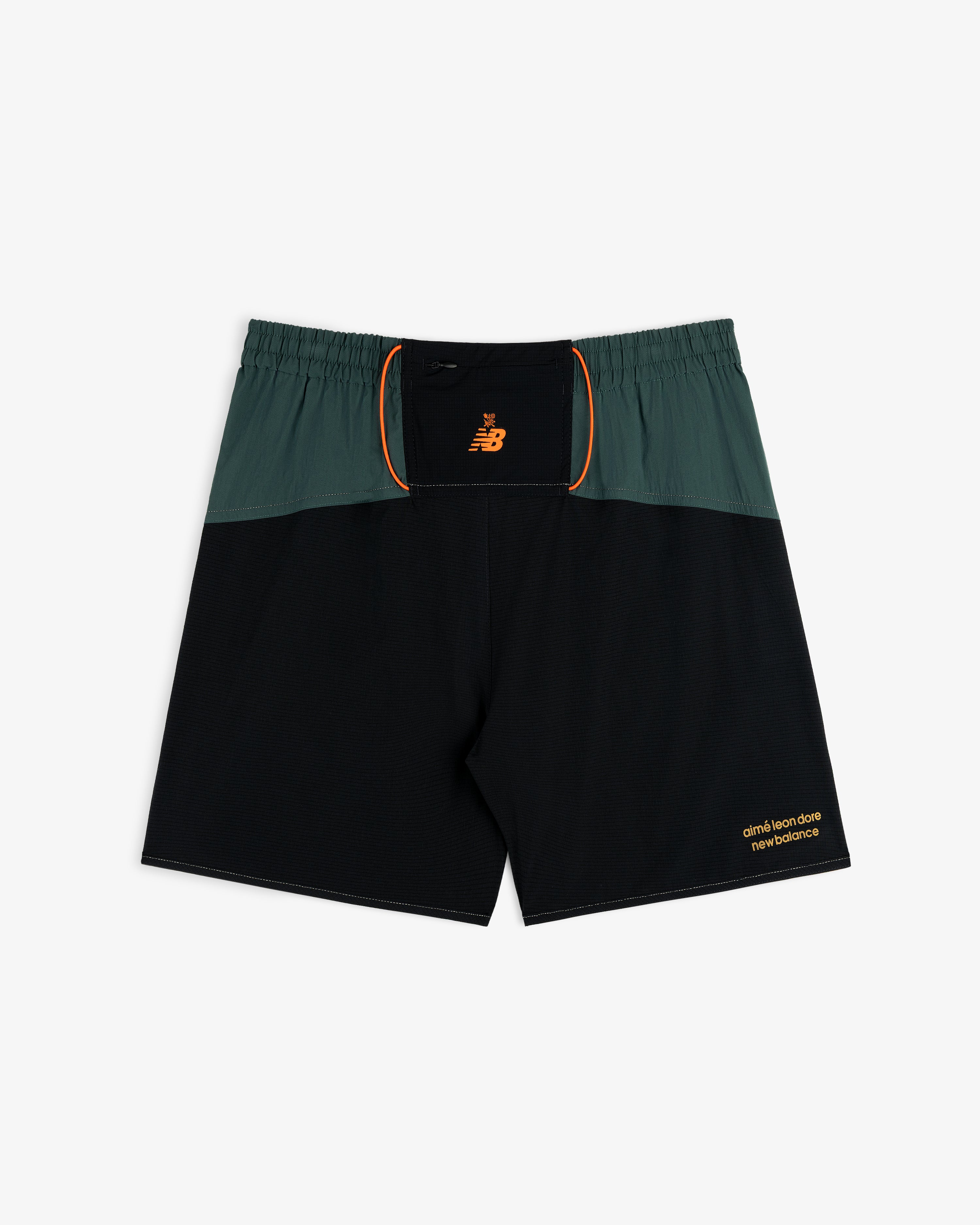ALD / New Balance Performance Lightweight Running Short in green and black with orange trim and logo accents.