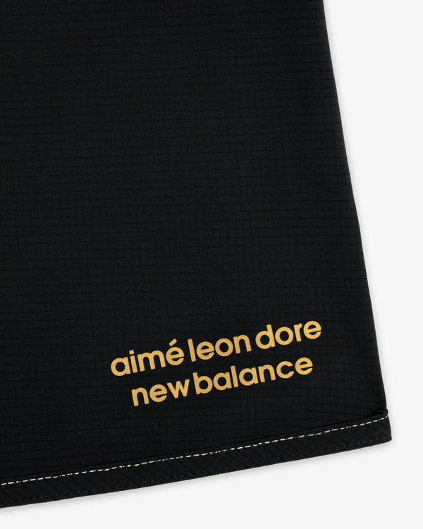 Black ALD / New Balance Performance Lightweight Running Short with yellow lowercase logo and white bottom stitching.