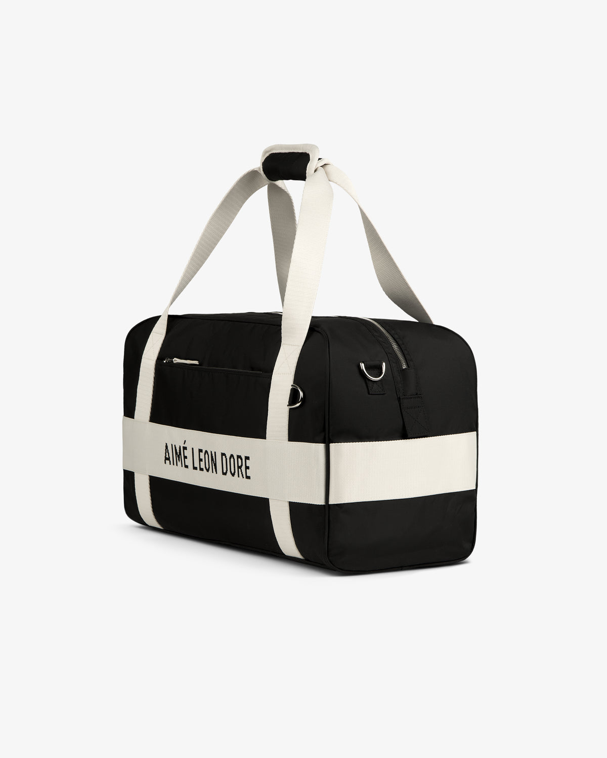 Black and white Nylon Duffle Bag with AIMÉ LEON DORE on the side and white straps, shown on a white background.