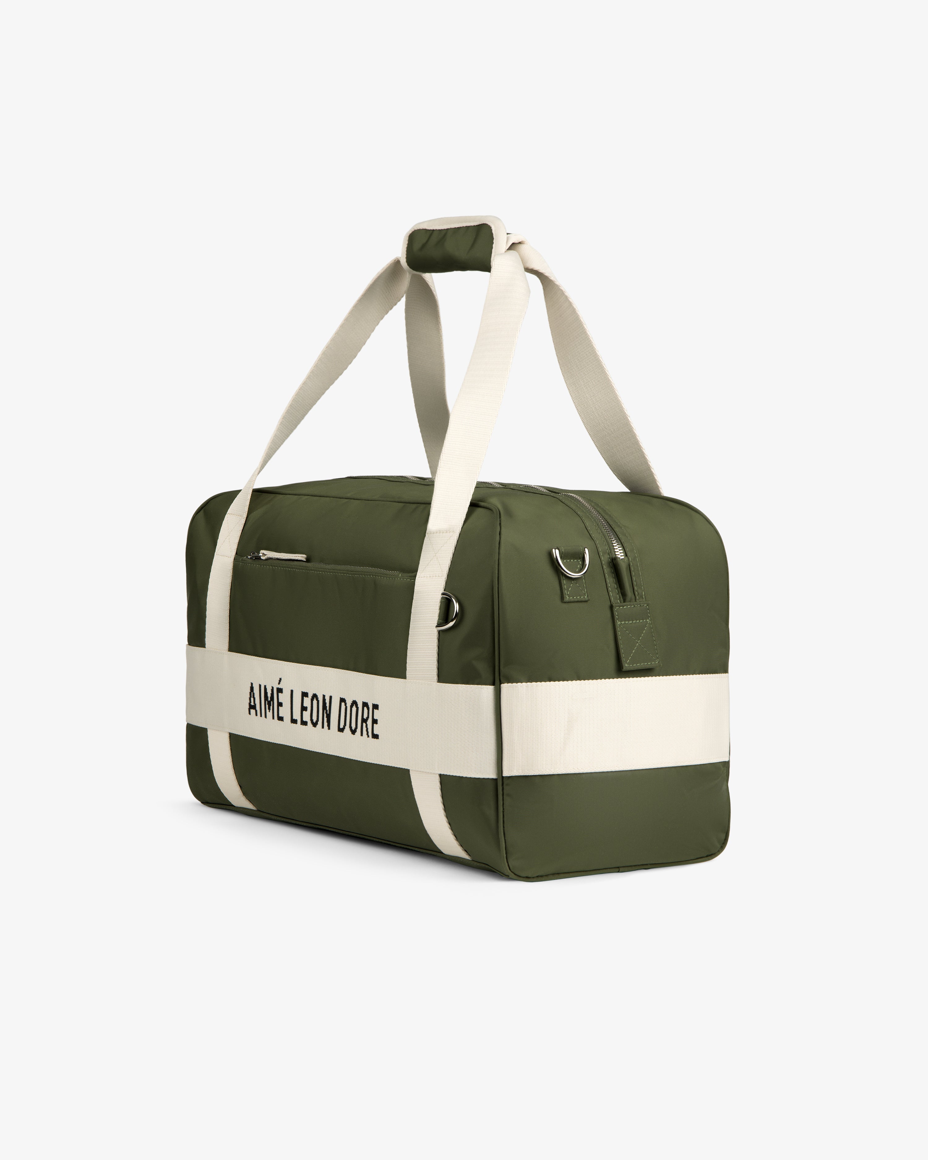 A green Nylon Duffle Bag with white straps and AIMÉ LEON DORE text, shown on a white background.