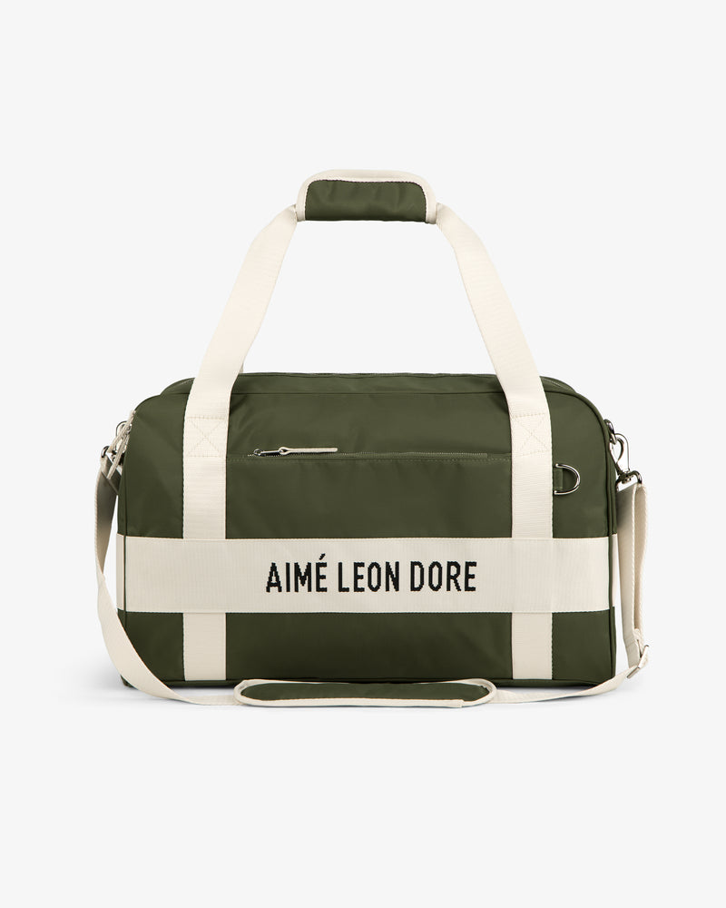 Olive green Nylon Duffle Bag with white straps and AIMÉ LEON DORE text on the front.