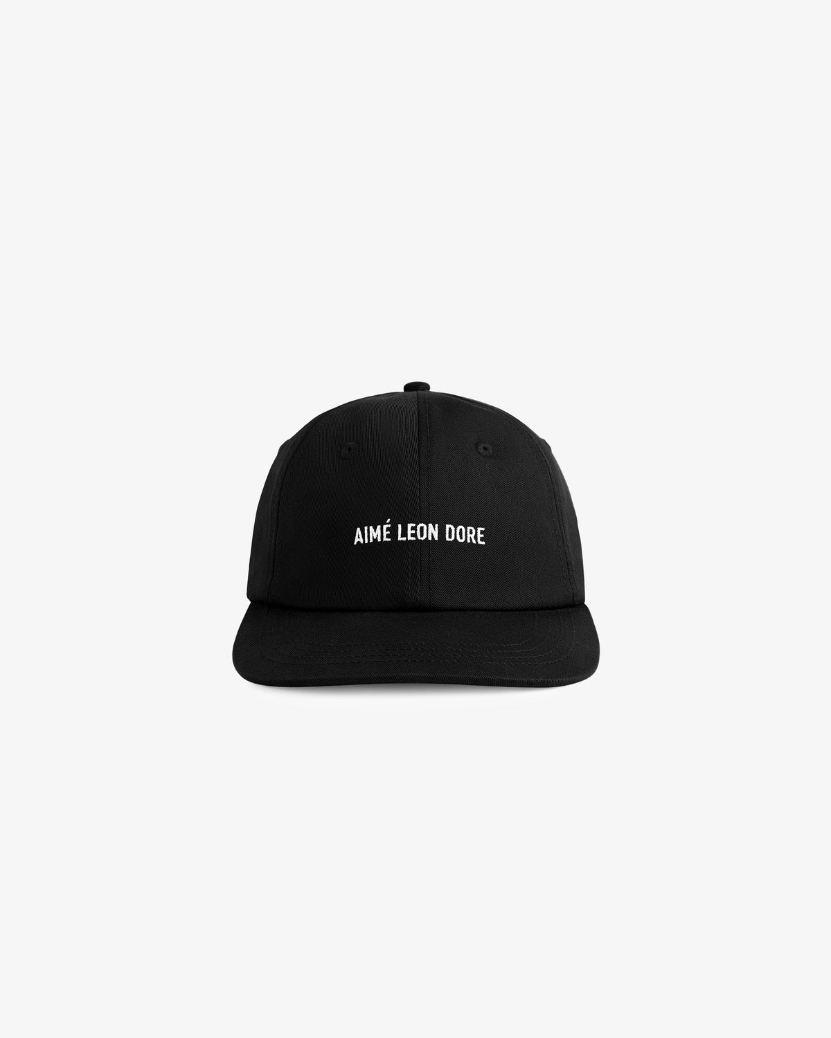 Core Logo Hat: black baseball cap with AIMÉ LEON DORE embroidered in white on the front, shown on a plain background.