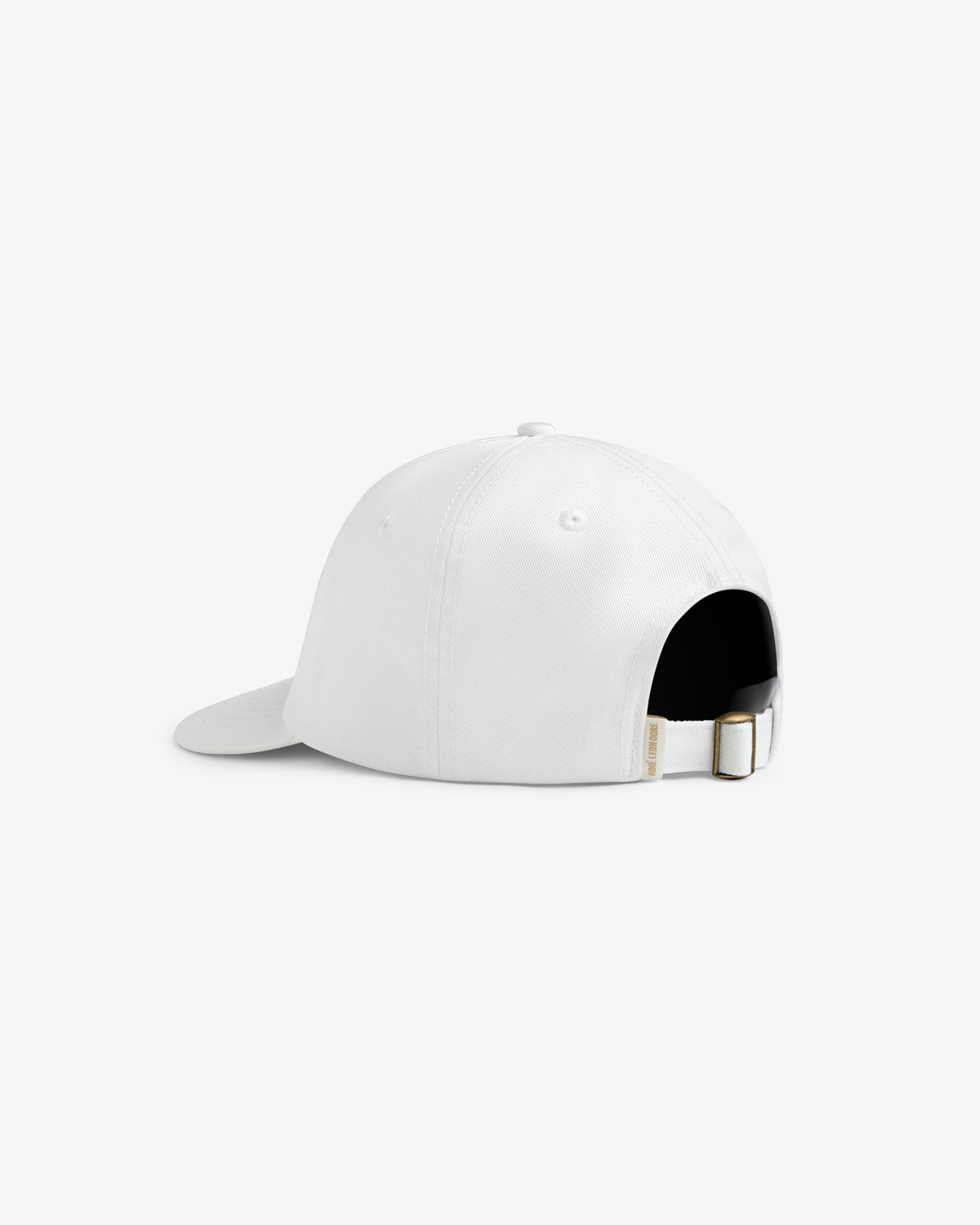 Core Logo Hat in white shown from the back, features an adjustable strap with metal buckle and top eyelets.
