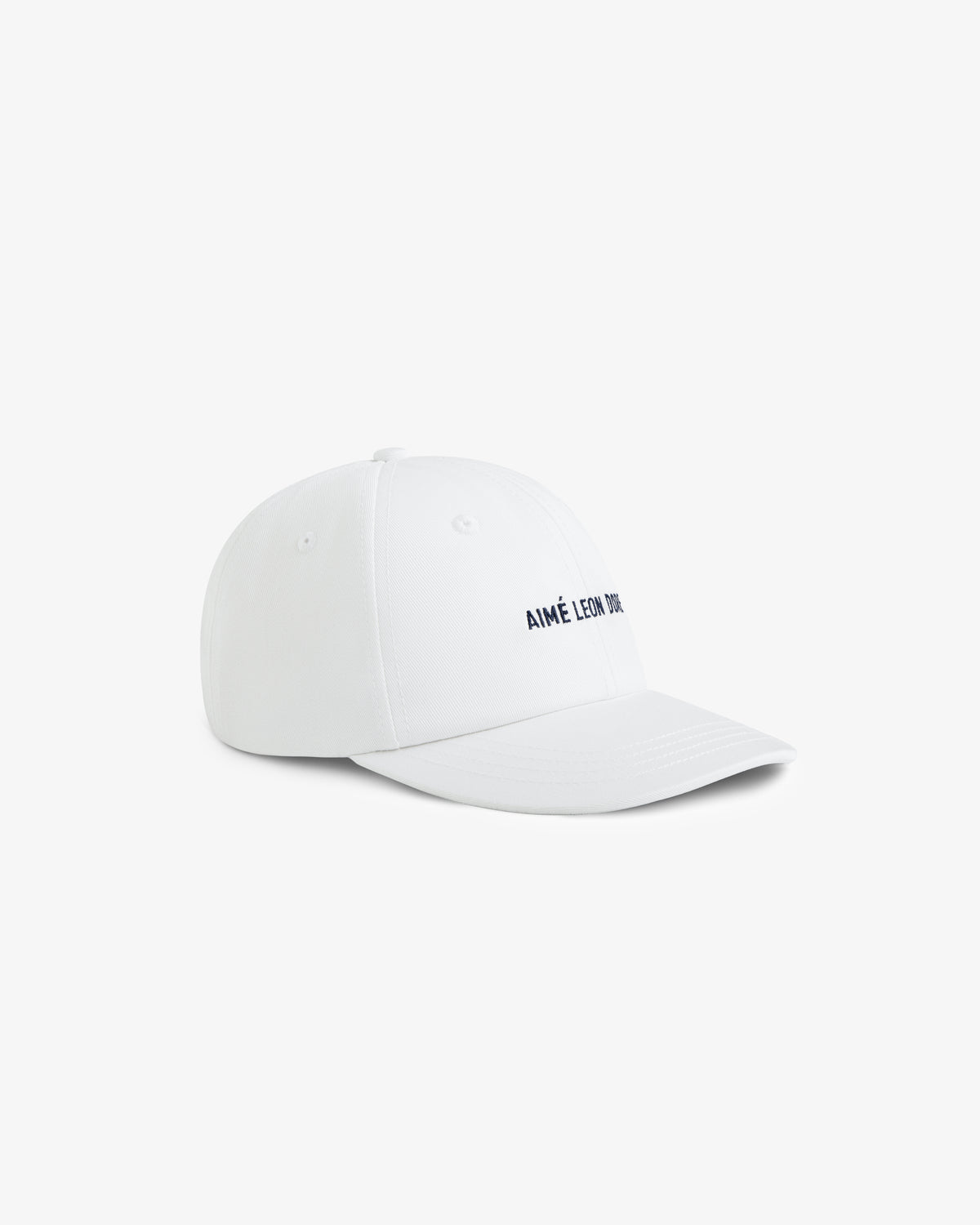 Core Logo Hat in white with AIMÉ LEON DORE embroidered in black, displayed on a plain white background.