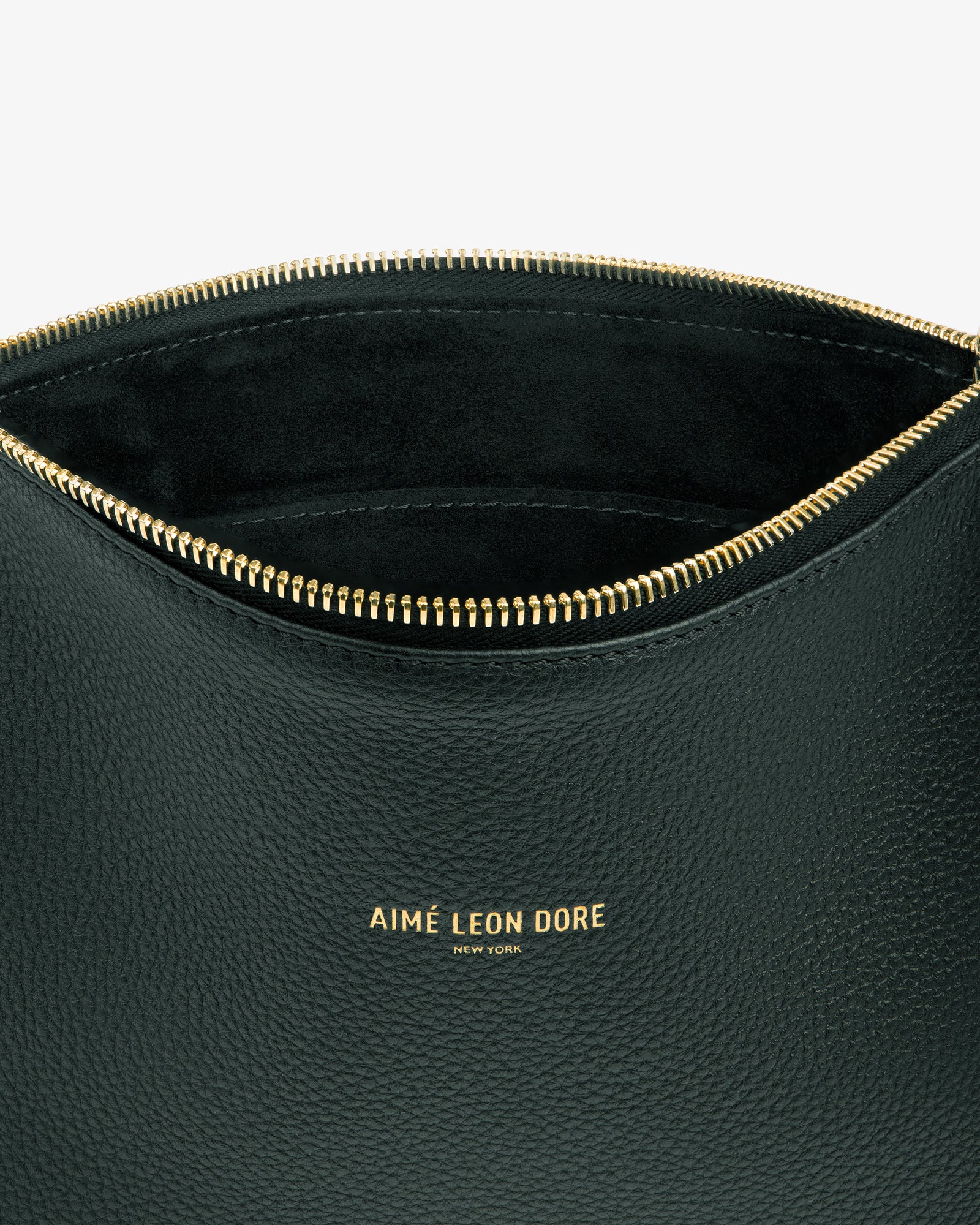 Close-up of a black leather Small Leather Pouch with gold zipper and gold embossed logo on the front.