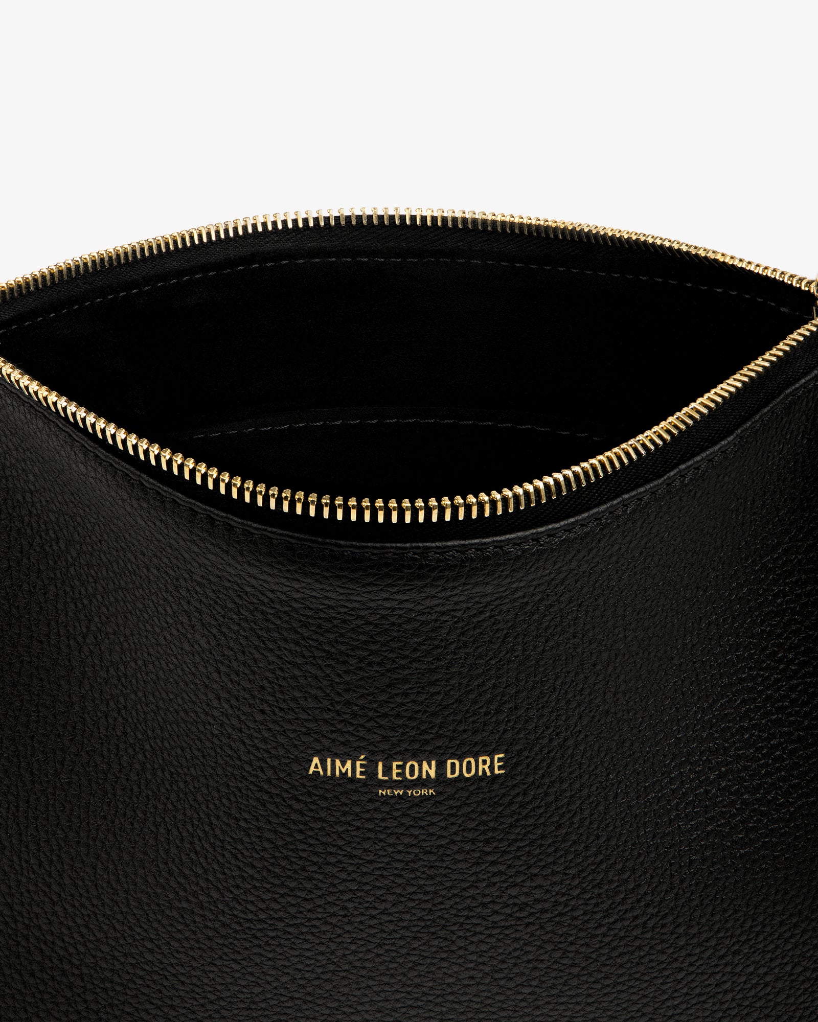Small Leather Pouch: black leather with gold zipper and AIMÉ LEON DORE NEW YORK in gold on the front.