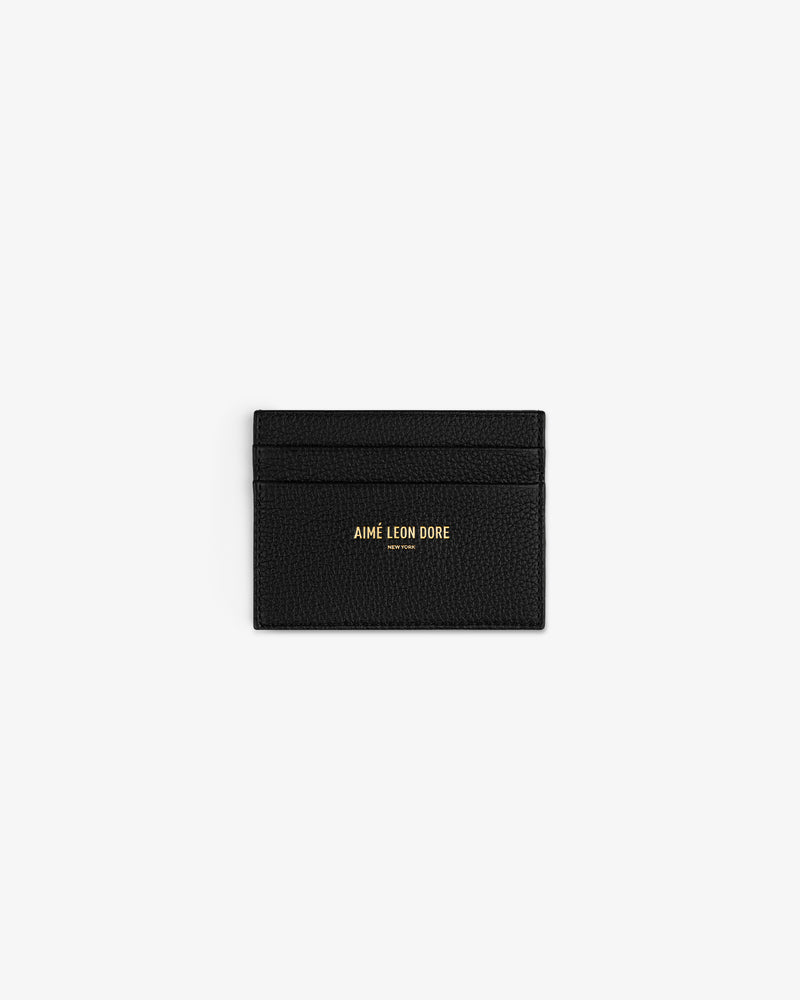 Leather Card Holder in black leather with gold AIMÉ LEON DORE print, shown centered on a white background.