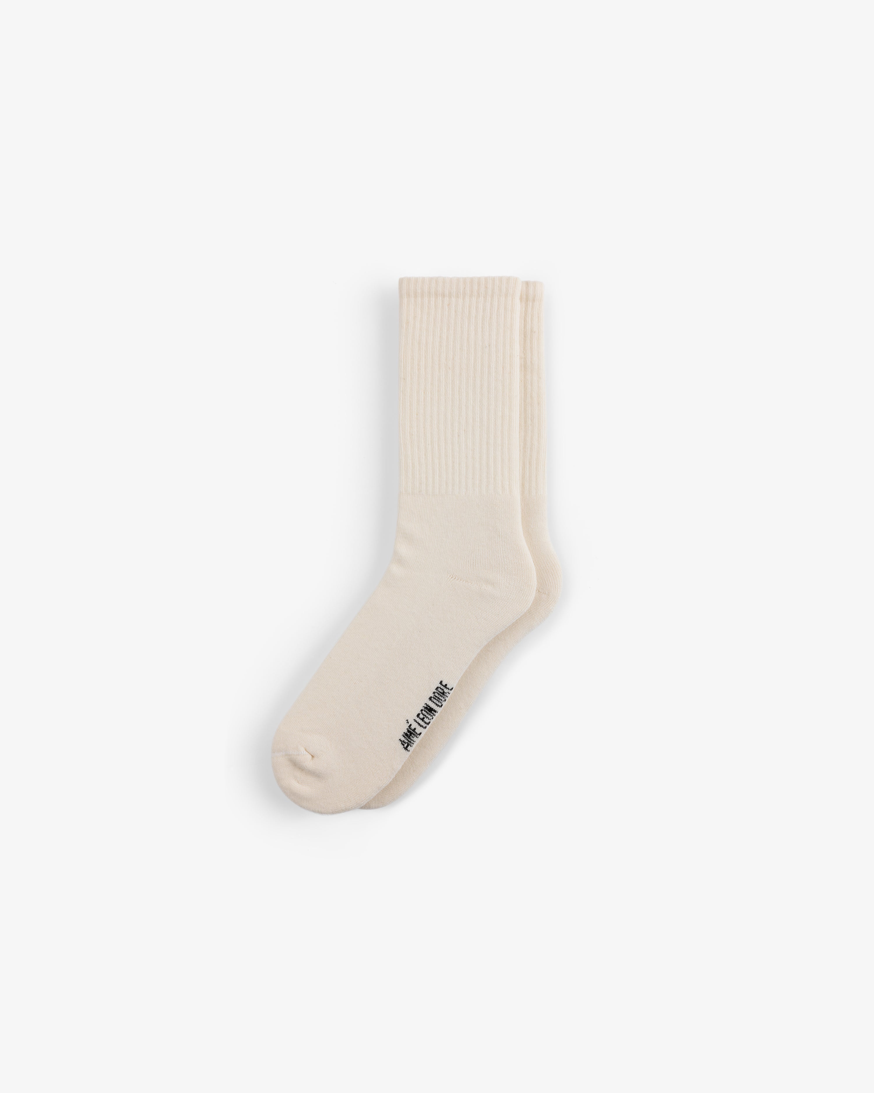 A single cream crew sock from the Crew Sock 3-Pack with ribbed details and small black text near the toe on white.