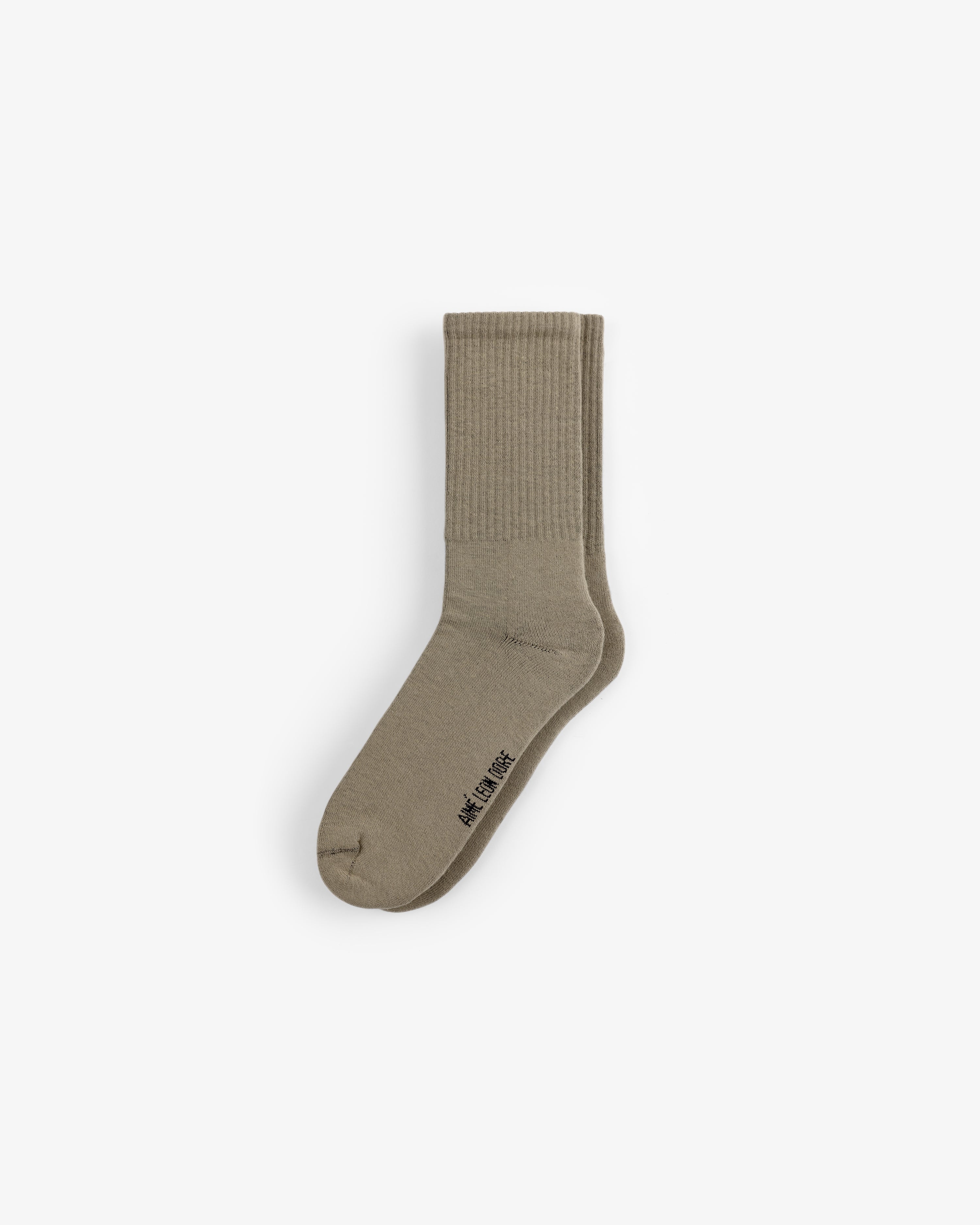 A single beige Crew Sock 3-Pack sock with ribbed ankle and WE11DONE text near the toe, on a plain white background.