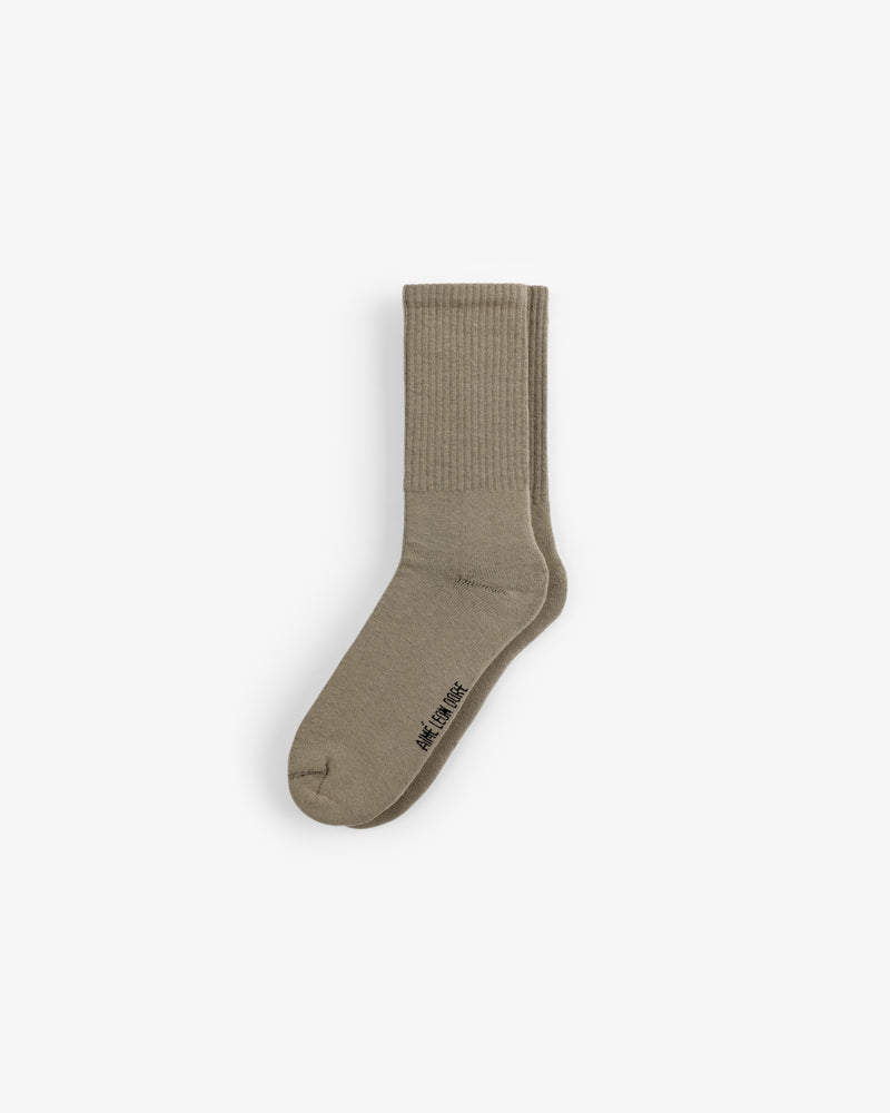 A single beige Crew Sock 3-Pack sock with ribbed ankle and WE11DONE text near the toe, on a plain white background.