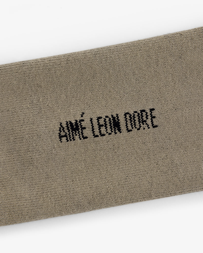Beige Crew Sock 3-Pack with black AIMÉ LEON DORE embroidery centered on the fabric.