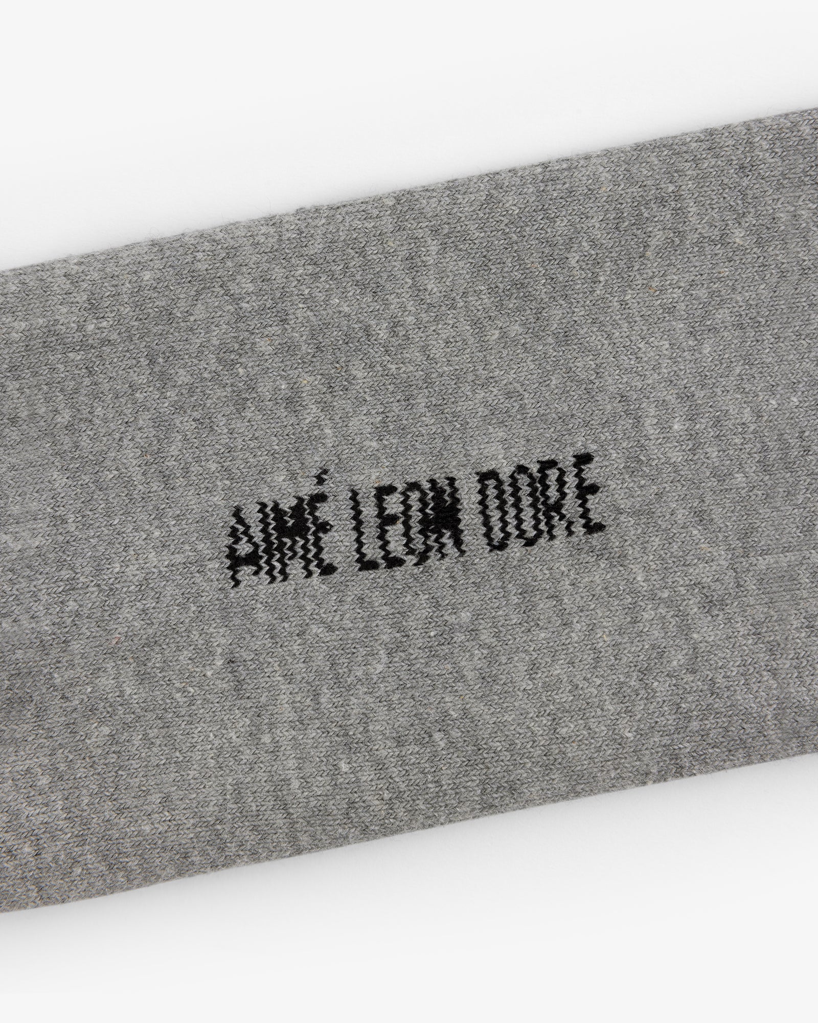 Gray Crew Sock 3-Pack with black AIMÉ LEON DORE stitching centered on the fabric.