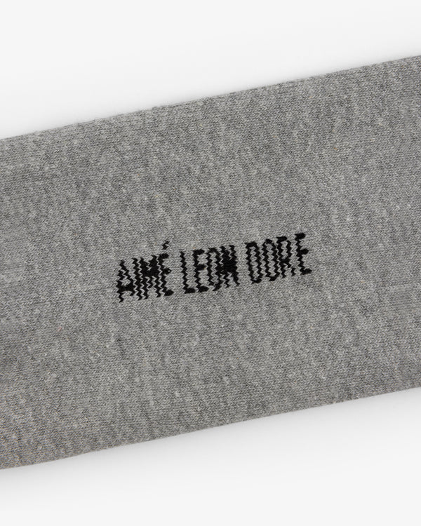 Gray Crew Sock 3-Pack with black AIMÉ LEON DORE stitching centered on the fabric.