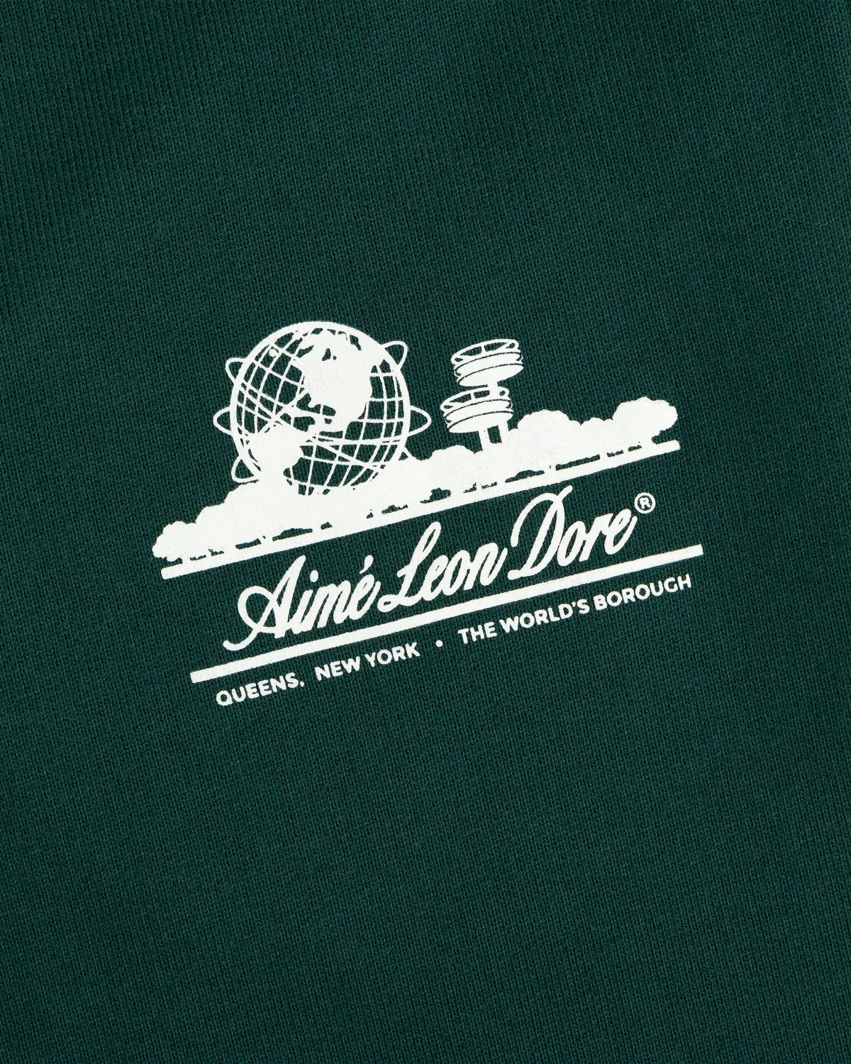Dark green Unisphere Sweatpants featuring a white Aimé Leon Dore globe logo above text.