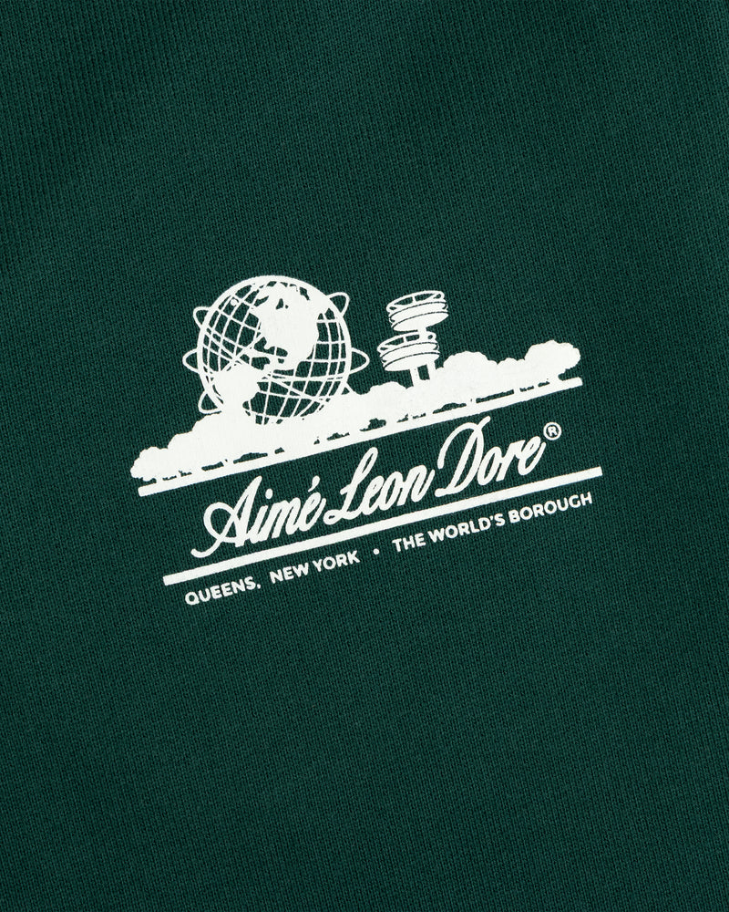 Dark green Unisphere Sweatpants featuring a white Aimé Leon Dore globe logo above text.