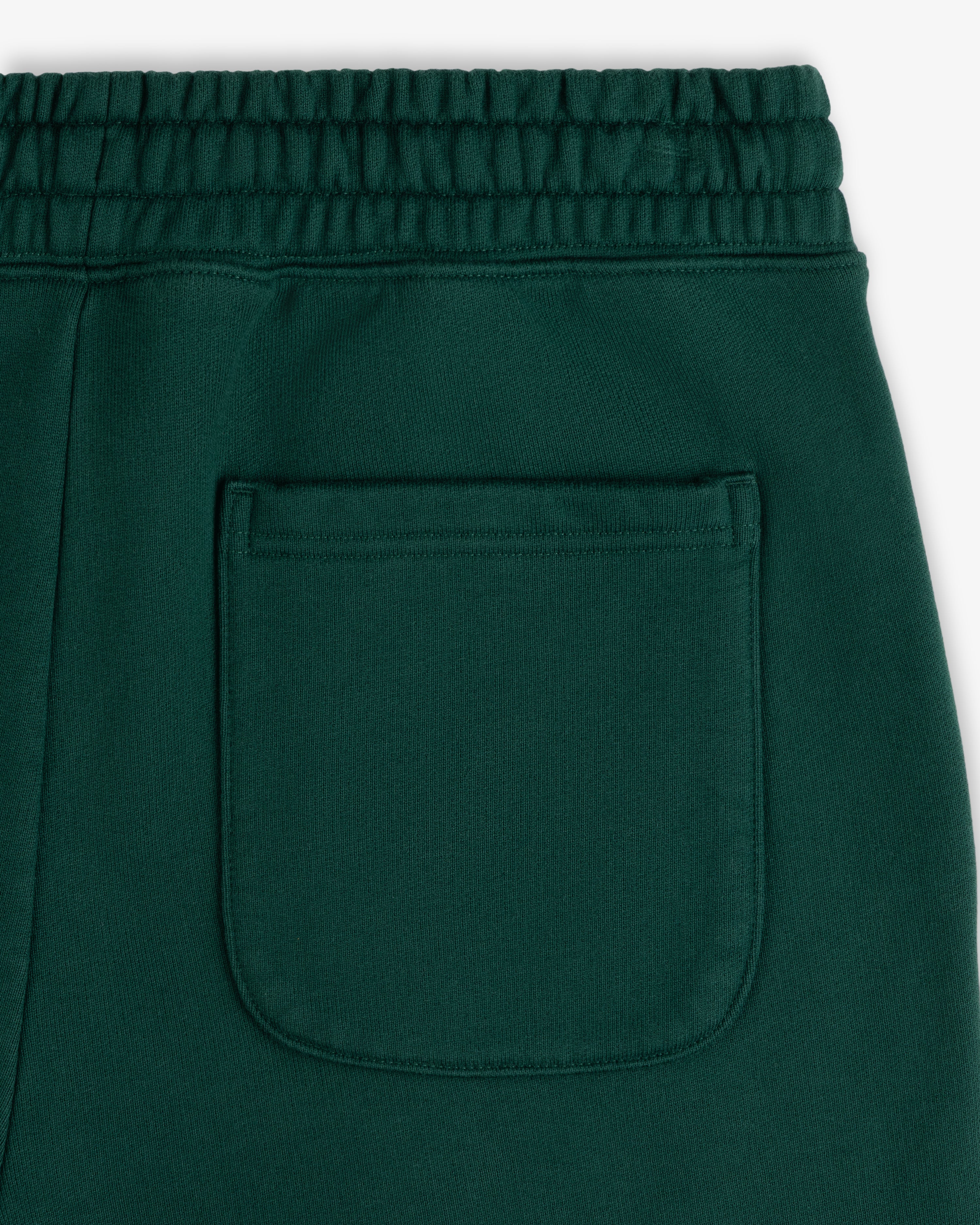 Unisphere Sweatpants: Dark green with elastic waistband and back patch pocket.