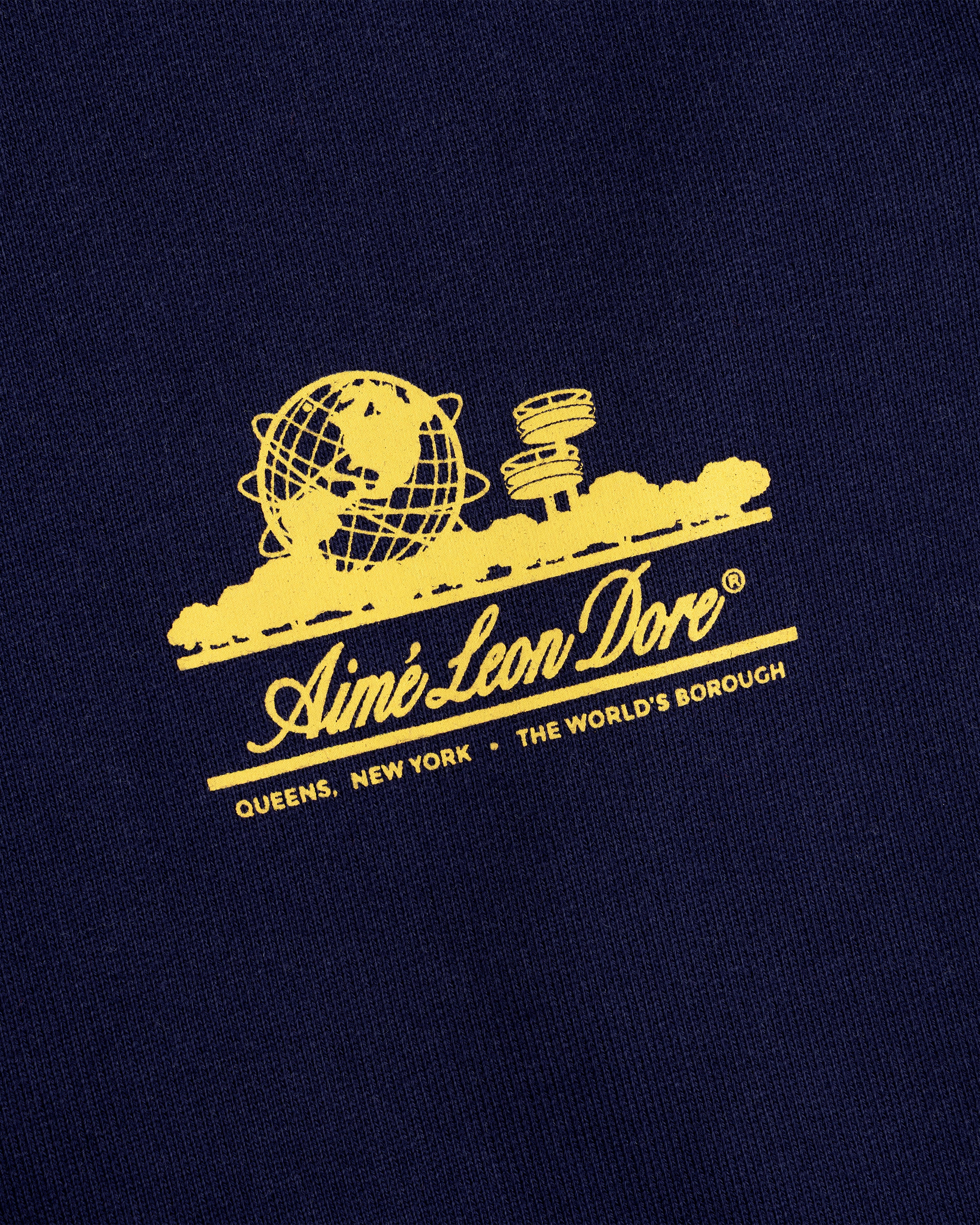 Navy Unisphere Sweatpants with yellow Unisphere graphic, Aimé Leon Dore text; Queens, NY detailed.