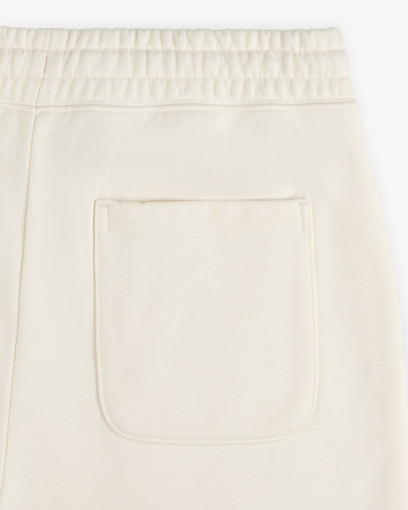 Close-up of Unisphere Sweatpants in cream with an elastic waistband and single back patch pocket.